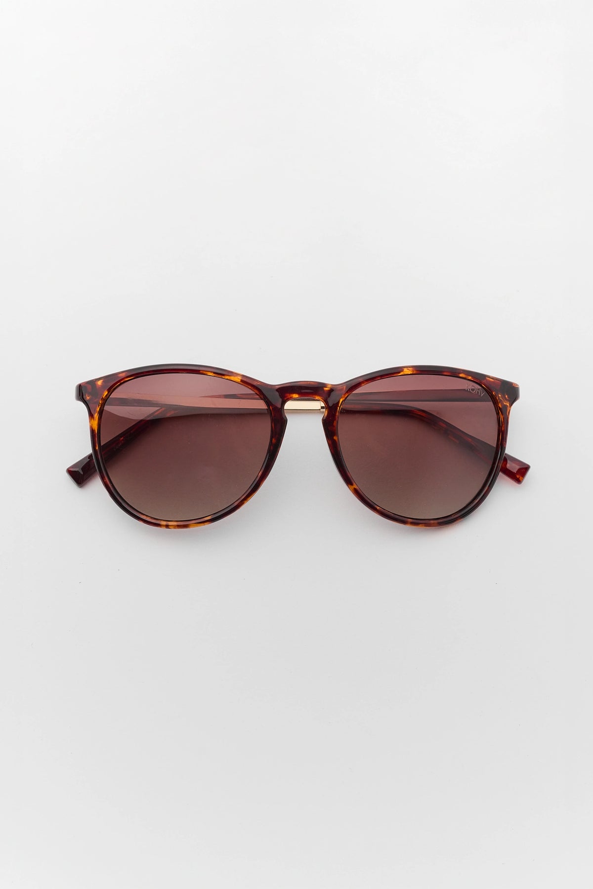 Tortoise Polarized Round Sunglasses - Flat Lay, Brown Gradient Lenses | Avara