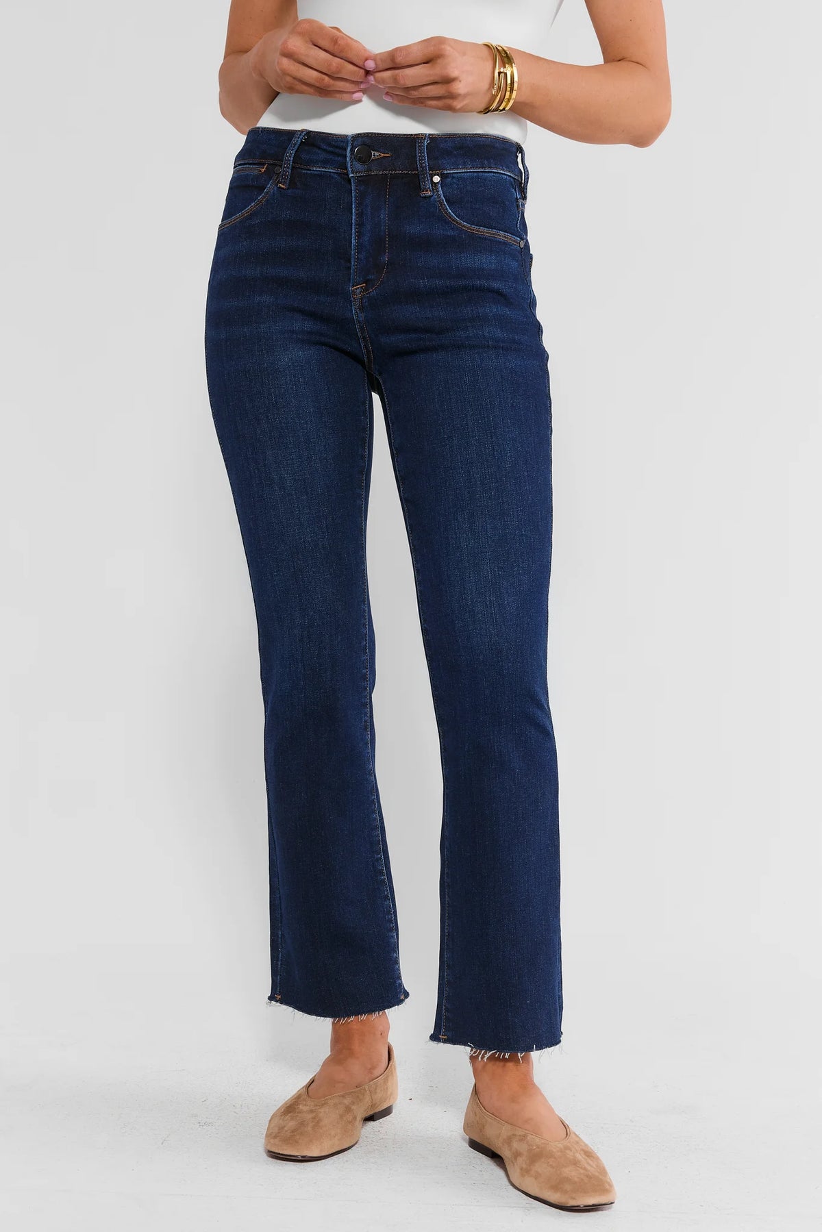 Becca Dark Wash Kick Flare Cropped Jeans - Front View On Model with Raw Hem | Avara