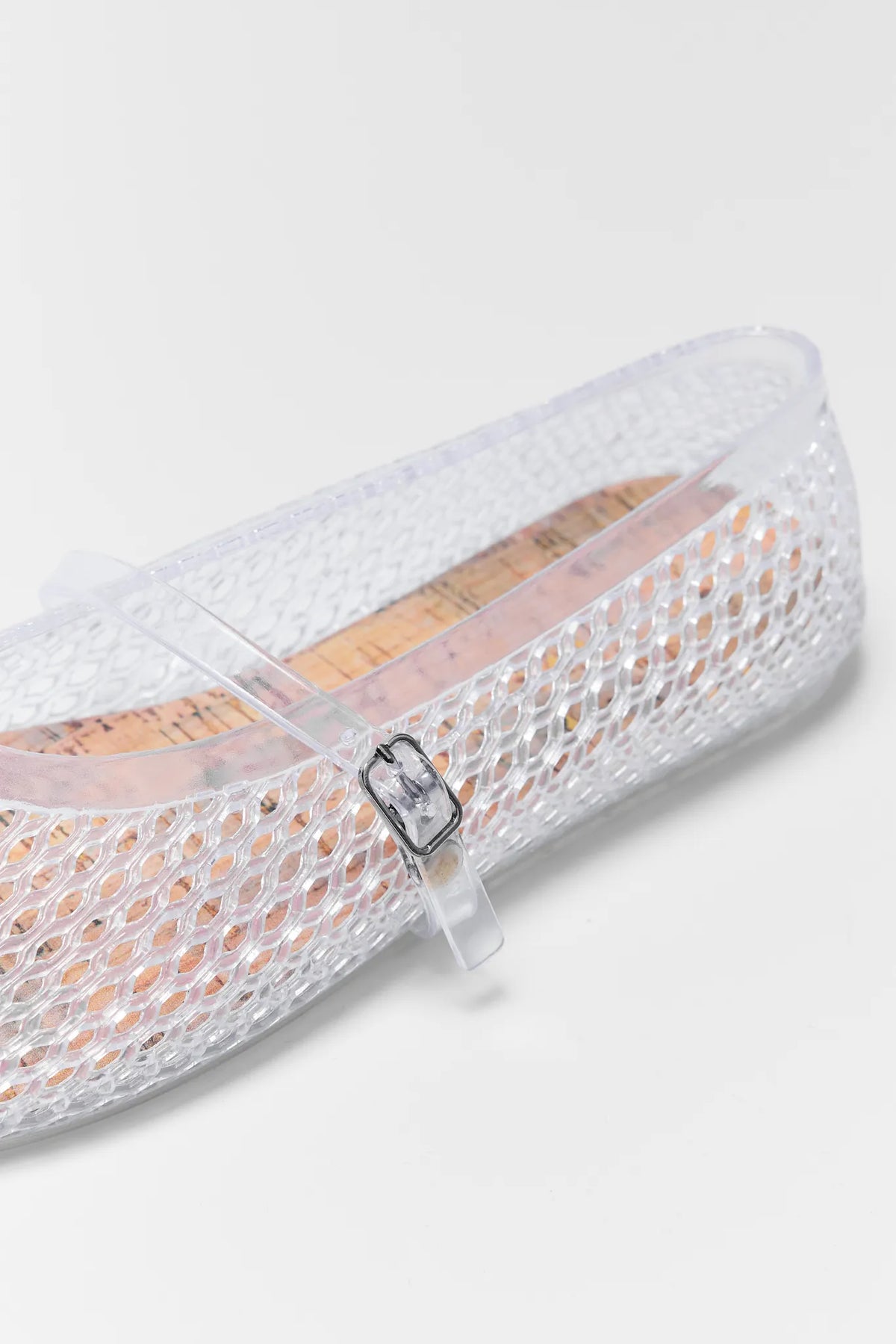 Sally Clear Jelly Flats with a strap on a light gray background