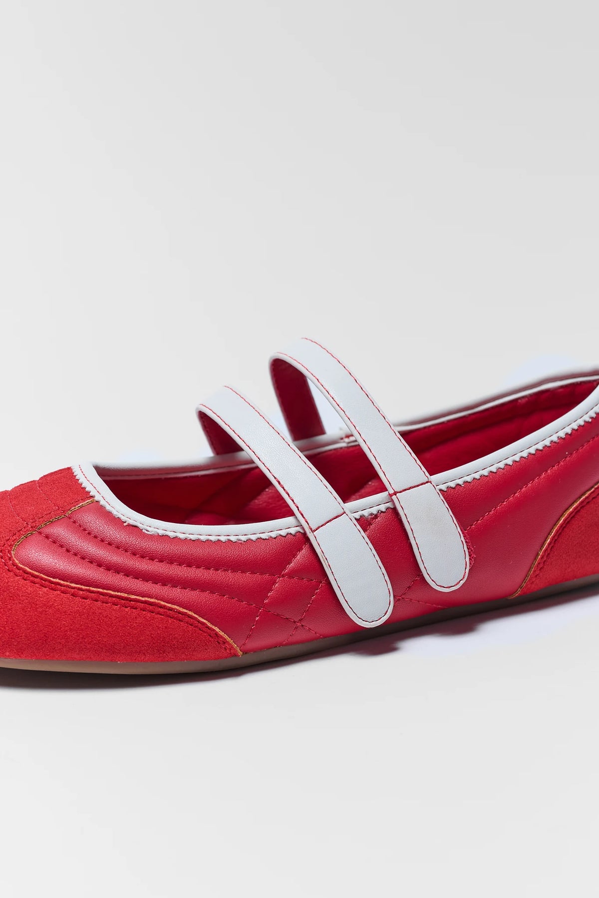close up of red flat sneaker