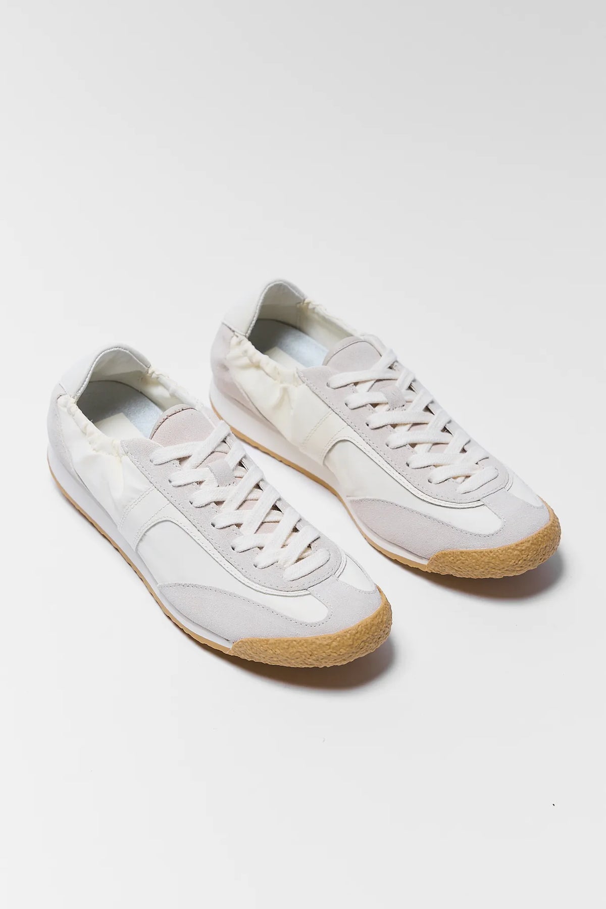 Dolce Vita Sariya white nylon sneakers pair with gum soles - 3/4 Angle View | Avara