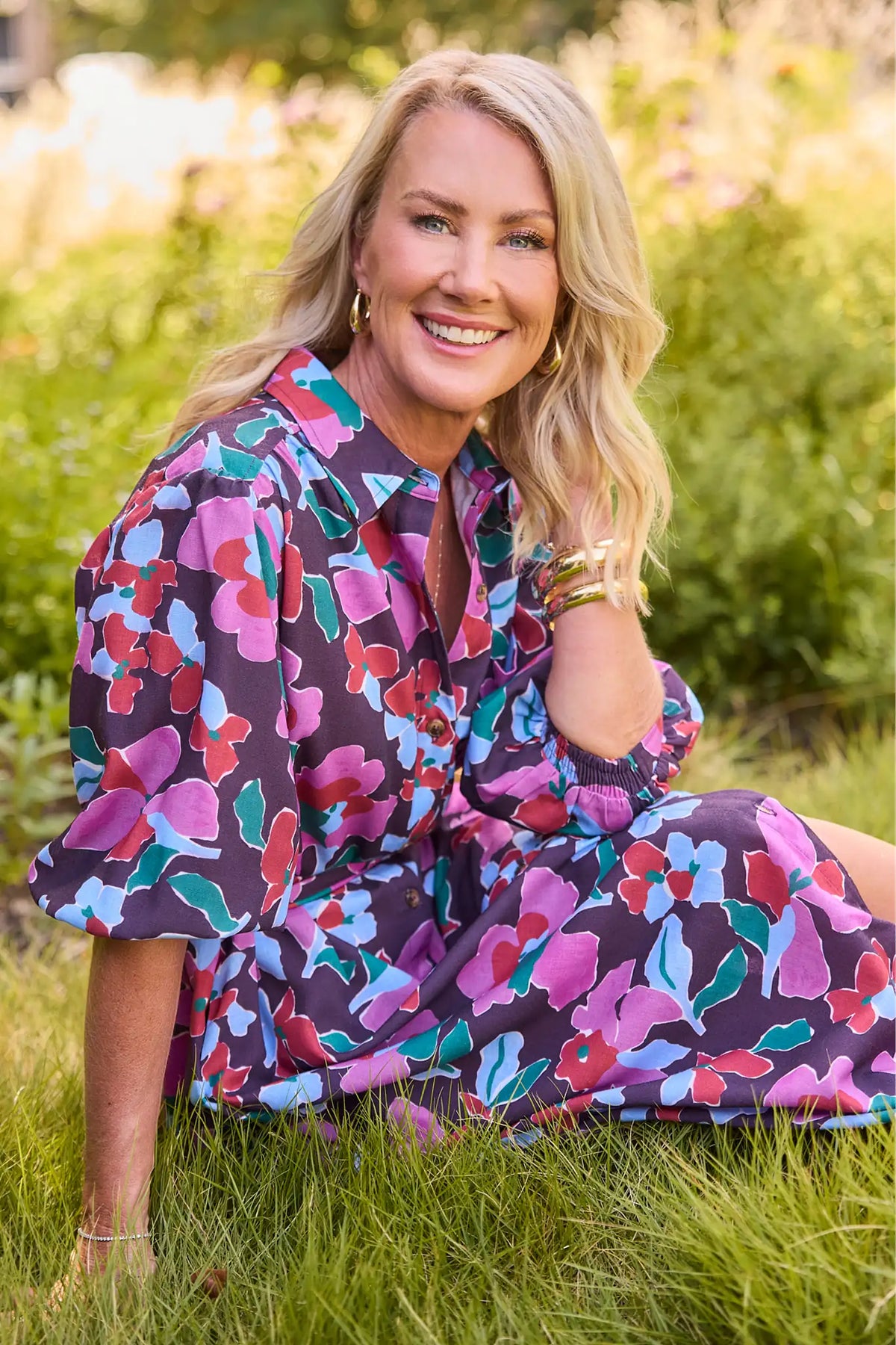 Purple Multi Floral Print Maxi Dress - On Model Seated Outdoor Lifestyle Shot, 3/4 Sleeve Detail | Avara