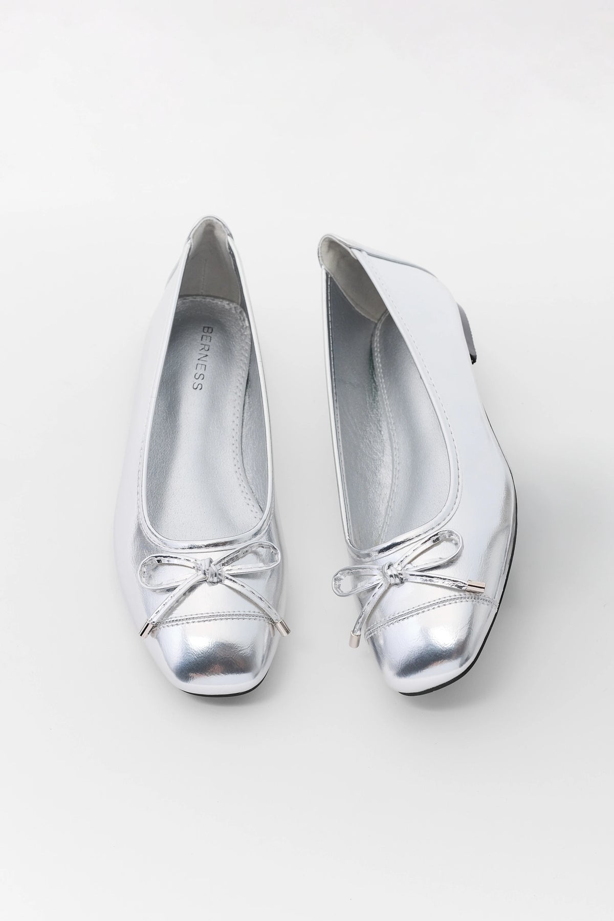 Silver Metallic Bow Ballet Flats - Top View, Round Toe Pair | Avara