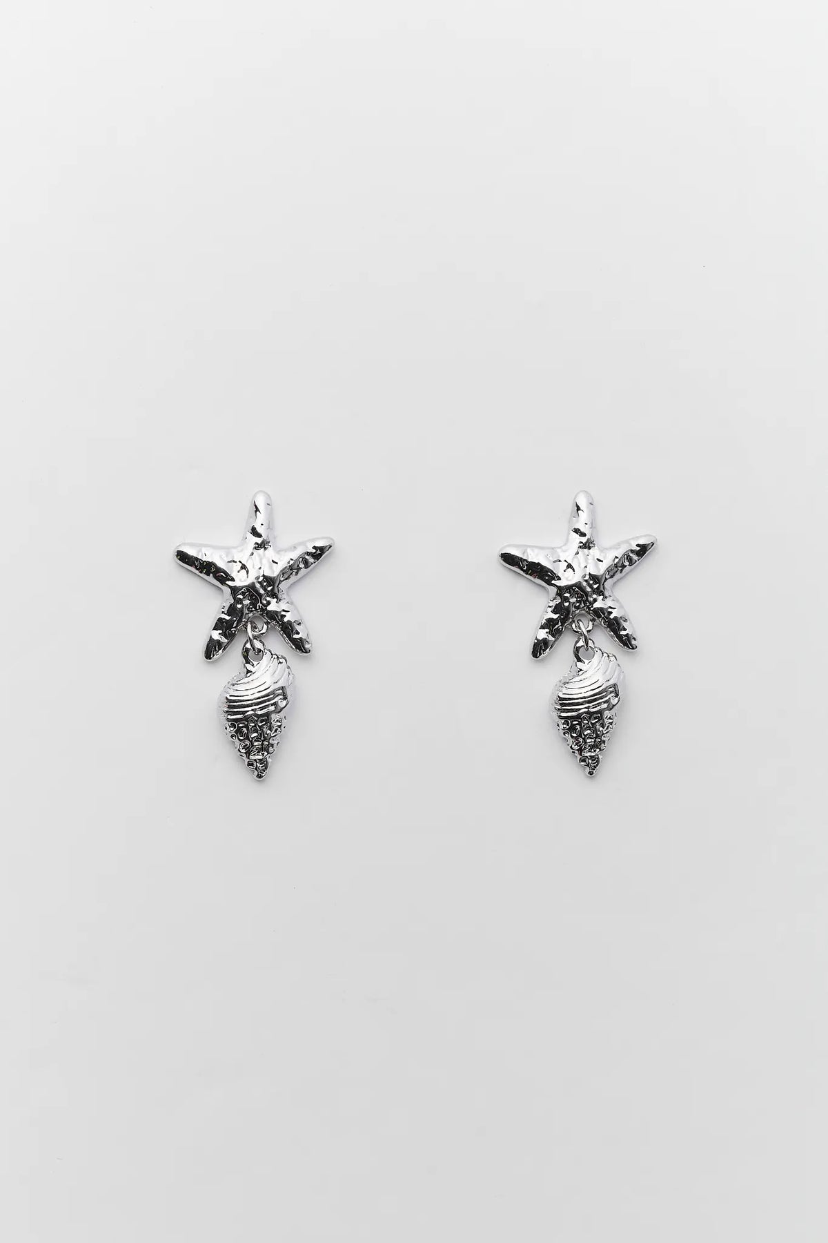 Sommer Silver Shell Drop Earrings - starfish and conch charm pair on gray background | Avara