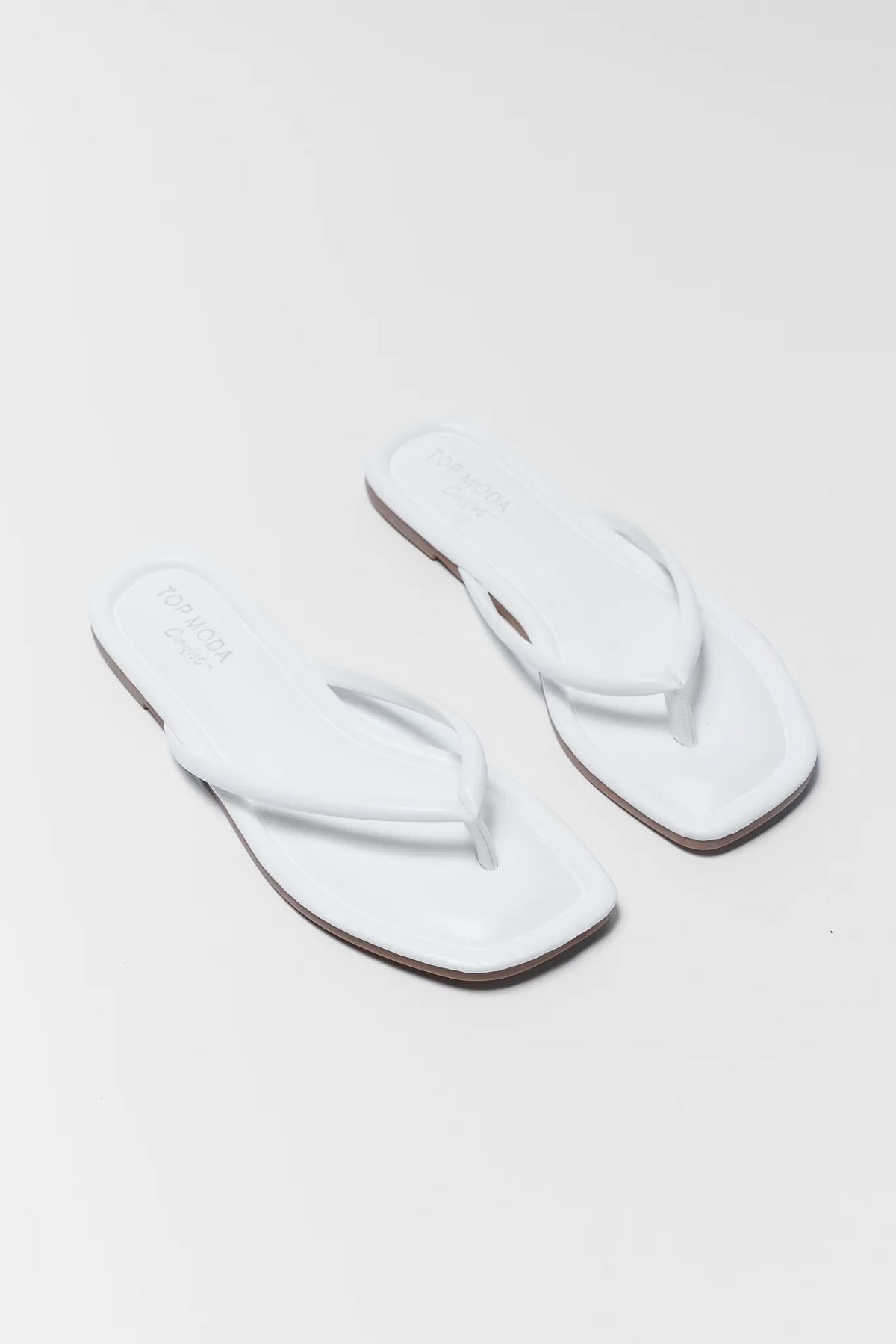 Taite White Square Toe Flip Flop Sandals - Diagonal Pair Flat Lay | Avara