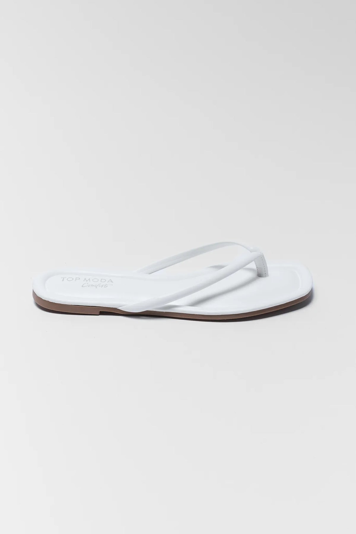 Taite White Faux Leather Flip Flop Sandal - Side Profile View | Avara