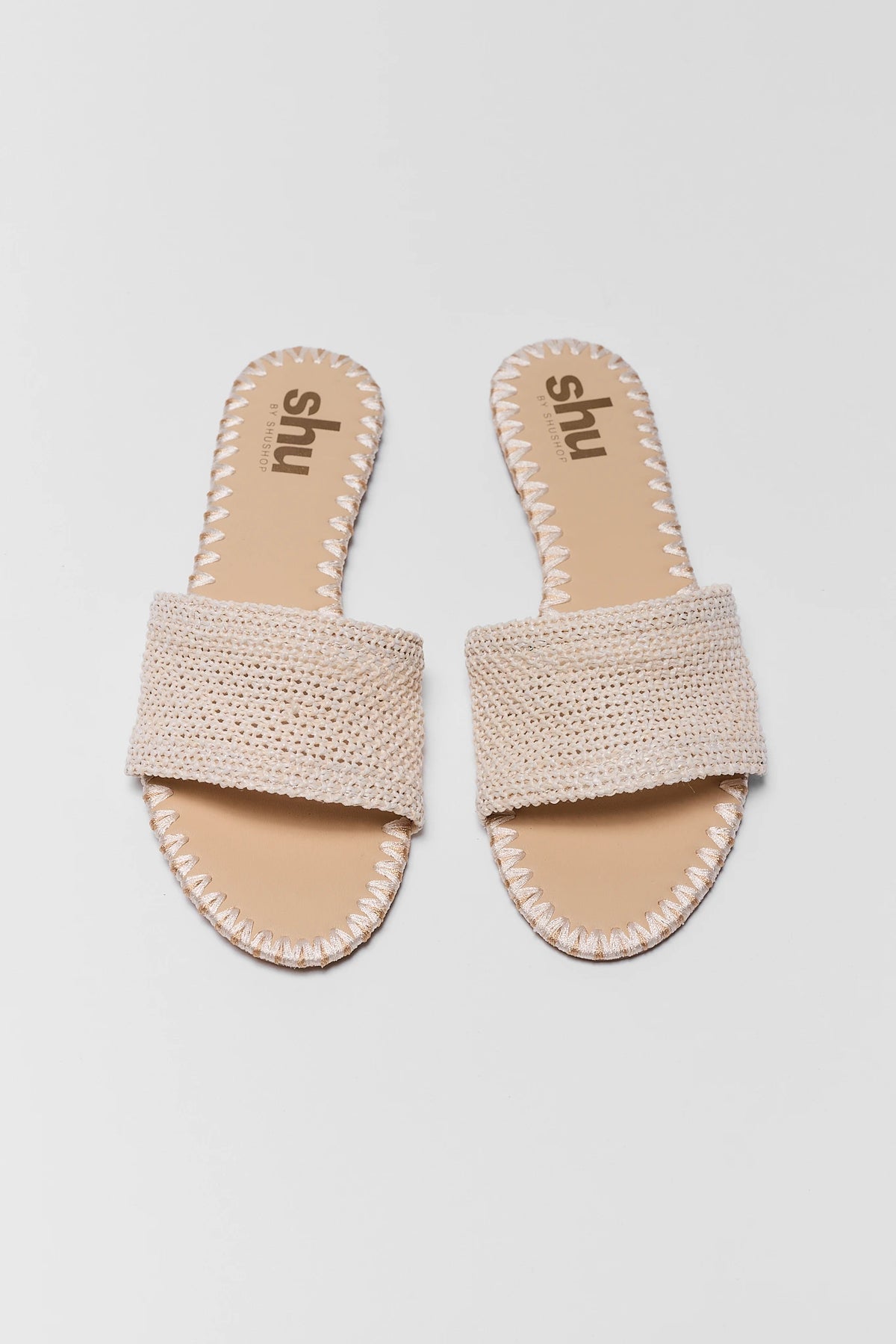 Tan Raffia Slide Sandal pair, flat lay front view showing open toe and woven strap | Avara