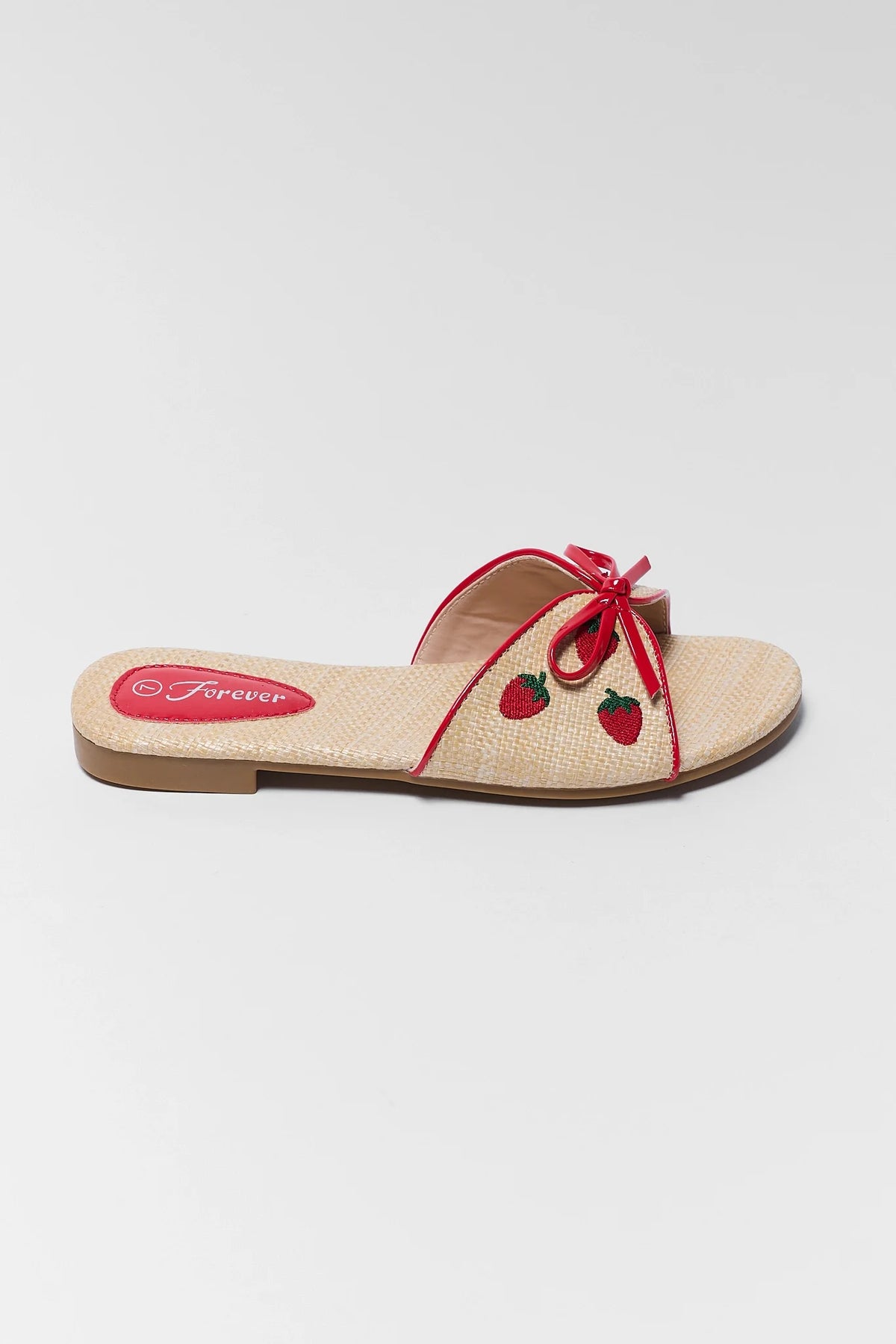 Tan Raffia Strawberry Sandal with red bow detail and embroidered strawberries - Side View | Avara