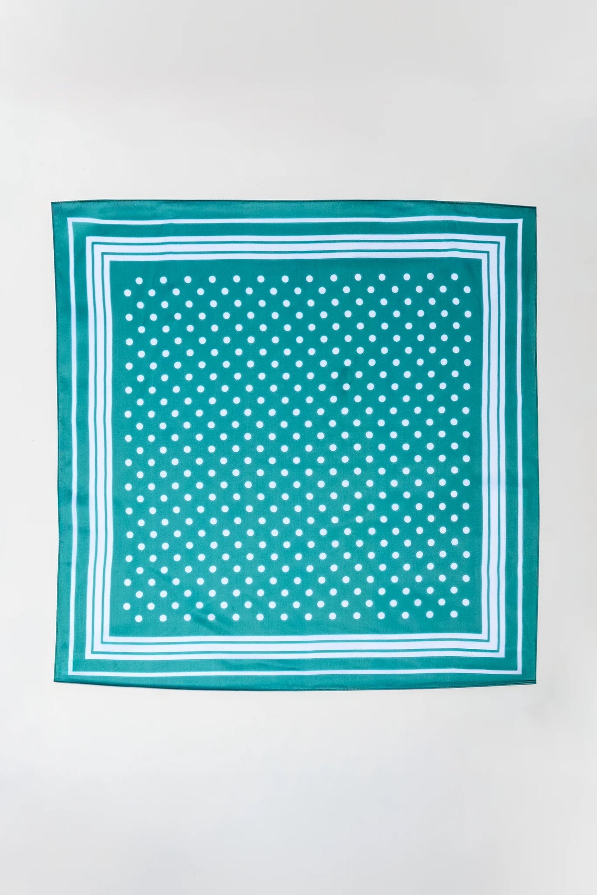 Teal green polka dot printed scarf with white border - Flat Lay | Avara