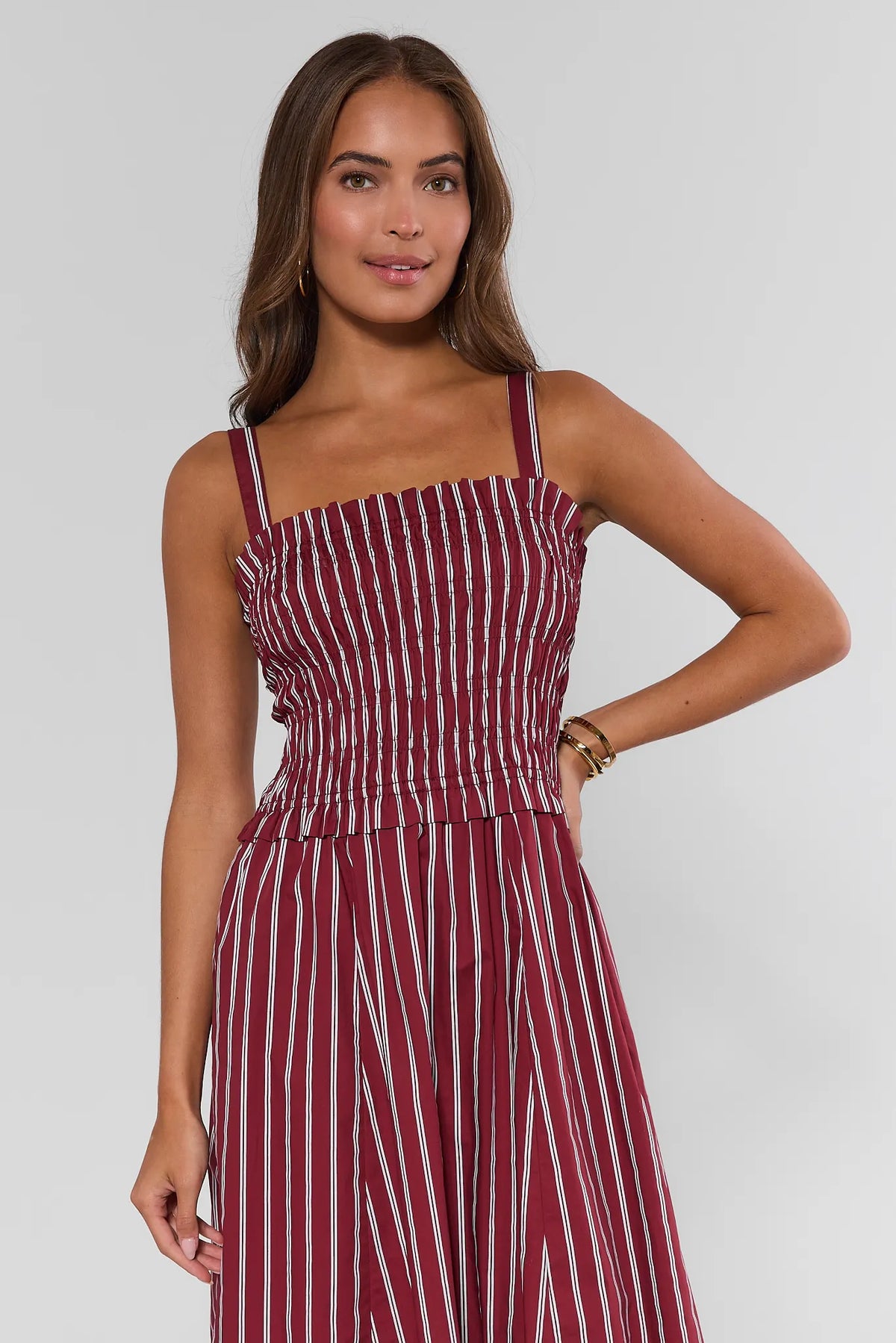 Maroon stripe smocked midi dress with ruffle bodice detail and wide straps - Side Front View | Avara