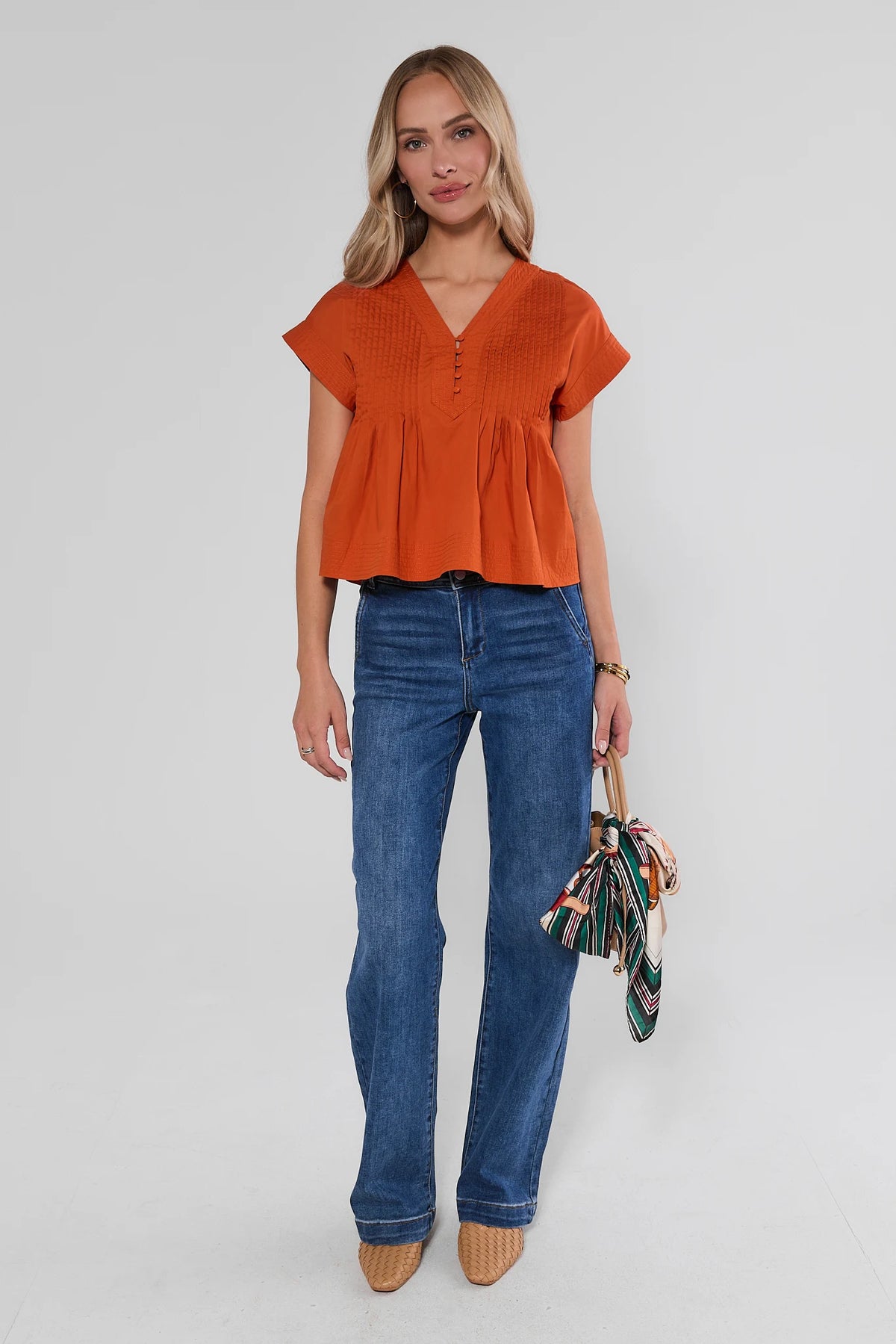 Orange Pleated Button Up Top full-length styled look with wide-leg jeans and woven mules | Avara