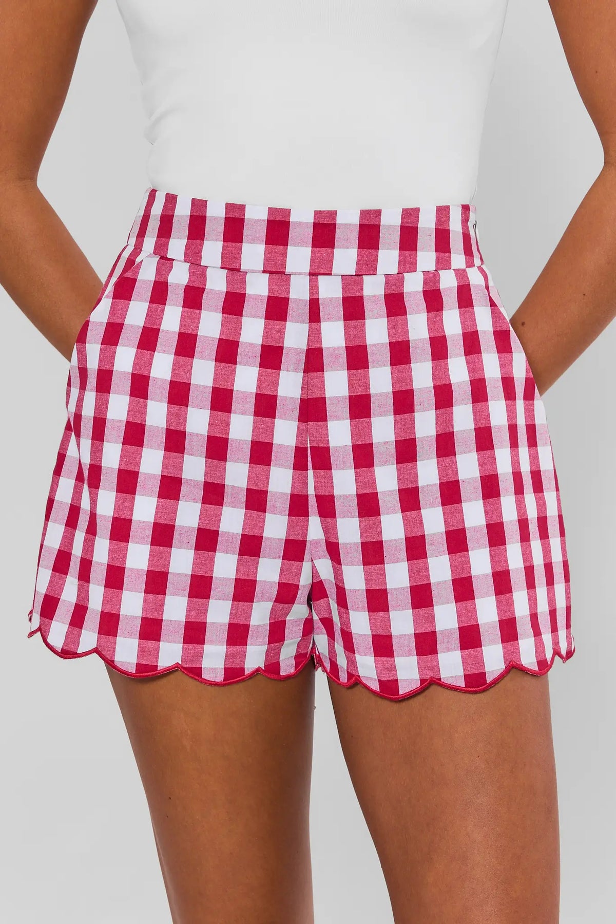 Red gingham scalloped shorts close-up front detail, high-waist with scalloped hem trim | Avara