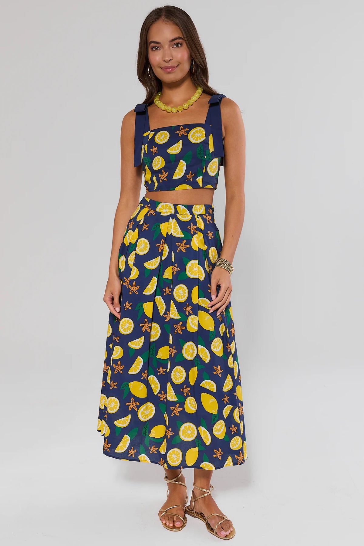 Navy lemon print maxi skirt styled as matching set with crop top - Full Length On Model | Avara