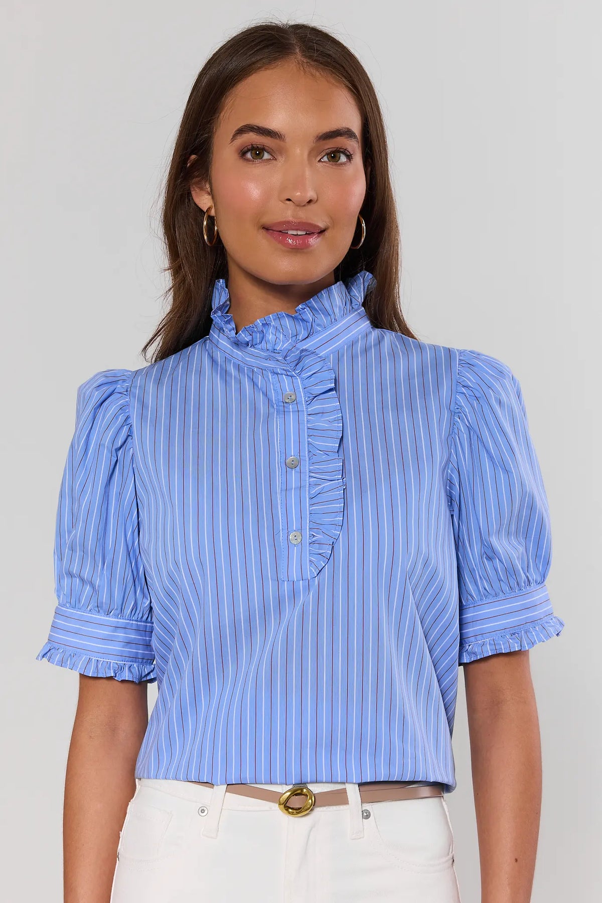 Woman wearing blue striped puff sleeve top with ruffle trim and button front - Front View | Avara