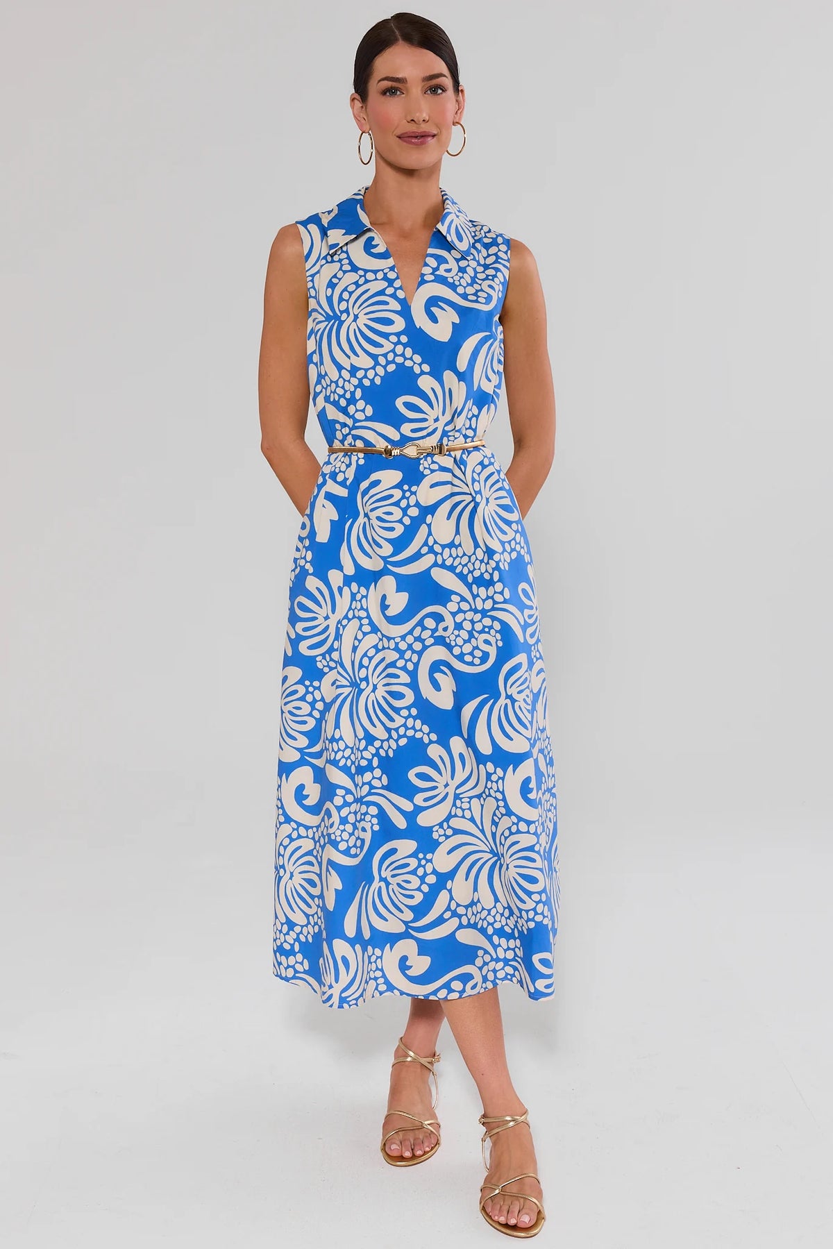 Blue printed maxi dress styled with gold belt and sandals, modest maxi length - Front View | Avara
