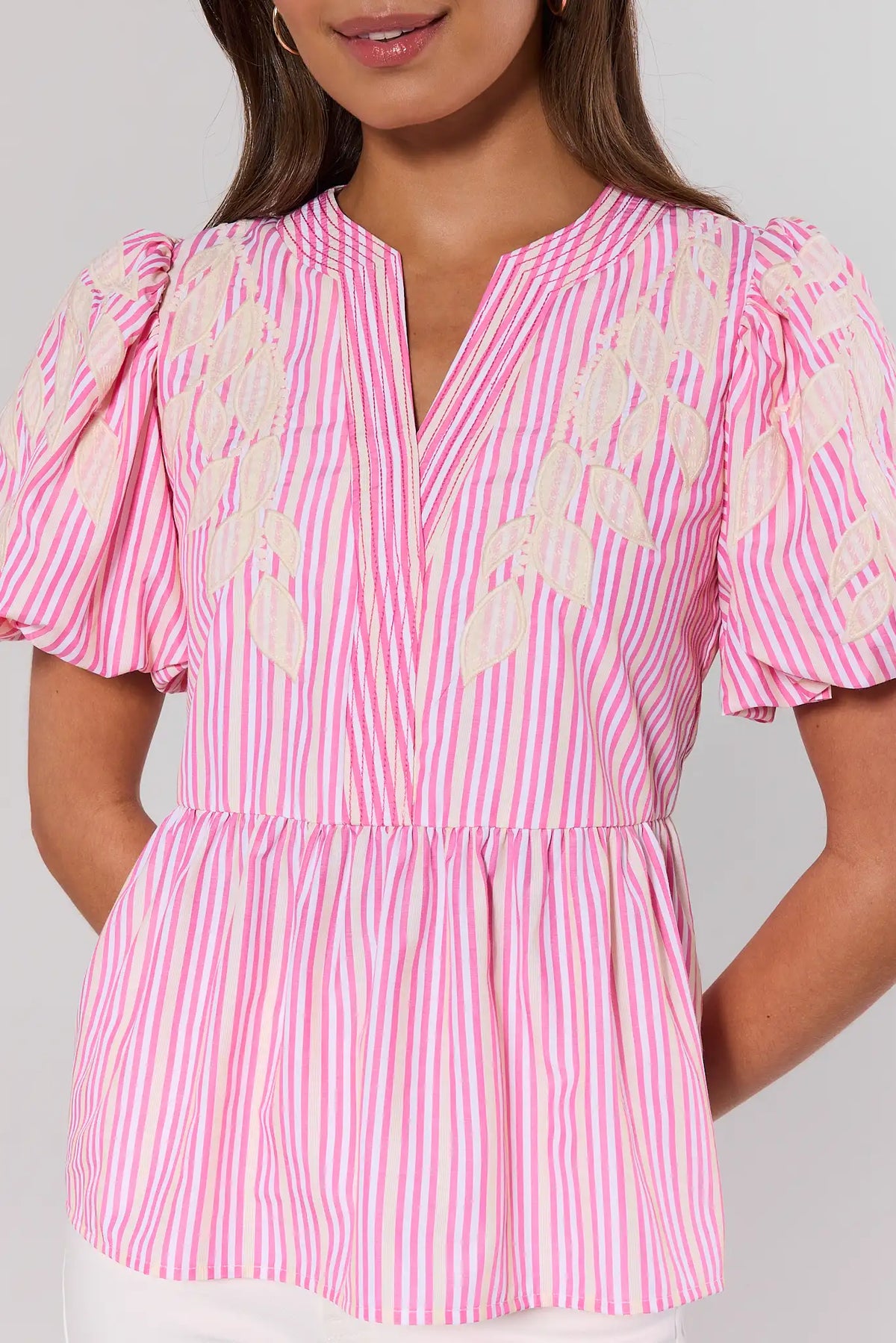 Alana Pink Stripe Peplum Top close-up showing puff sleeves and peplum hem detail | Avara