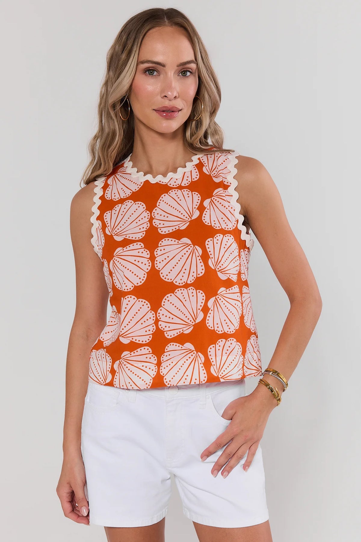 Orange shell print tank top with white ric-rac trim, front view styled with white shorts | Avara
