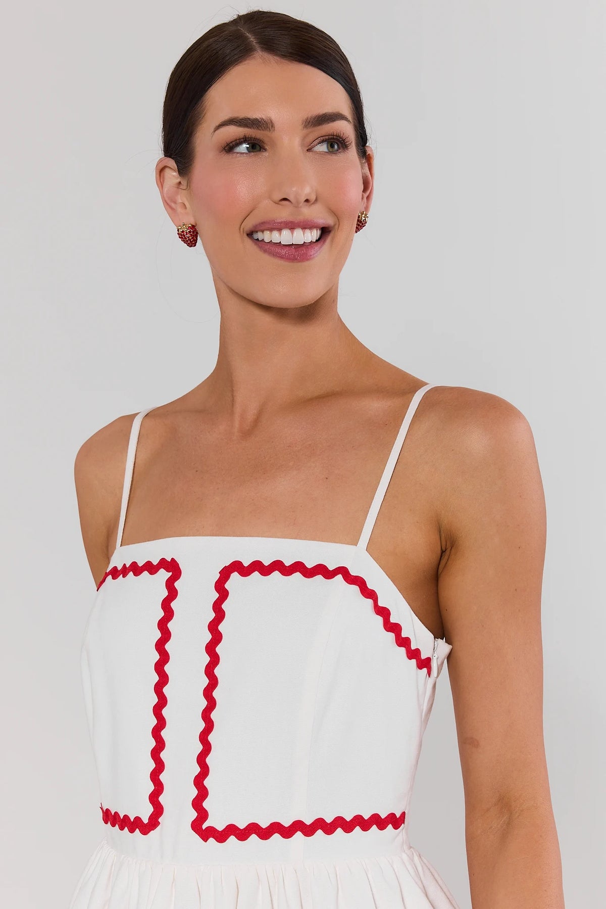 White midi dress with red ric-rac trim - Close-Up Bodice Detail On Model | Avara