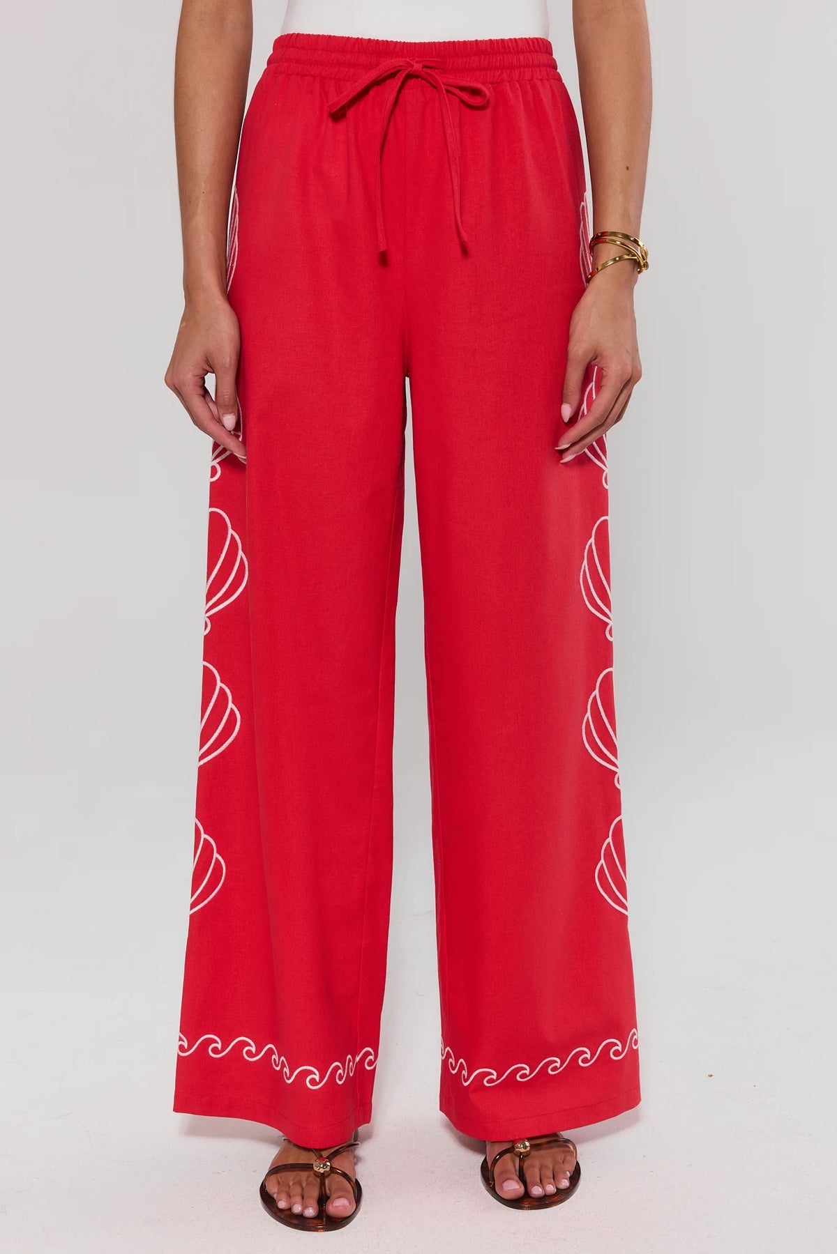 Red pants with white patterns on a white background