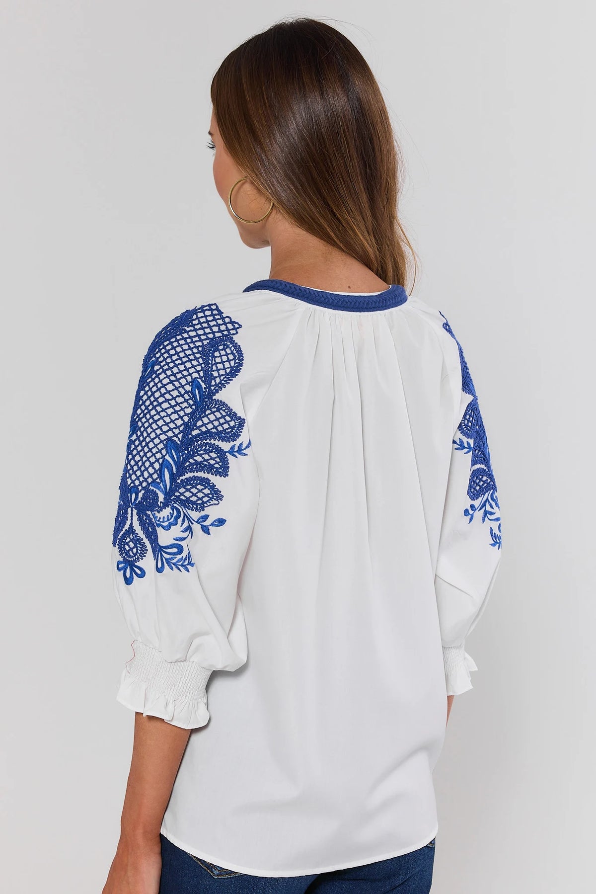 Iris White Embroidered Split Neck Top showing blue embroidery on sleeves and smocked cuffs - Back View | Avara
