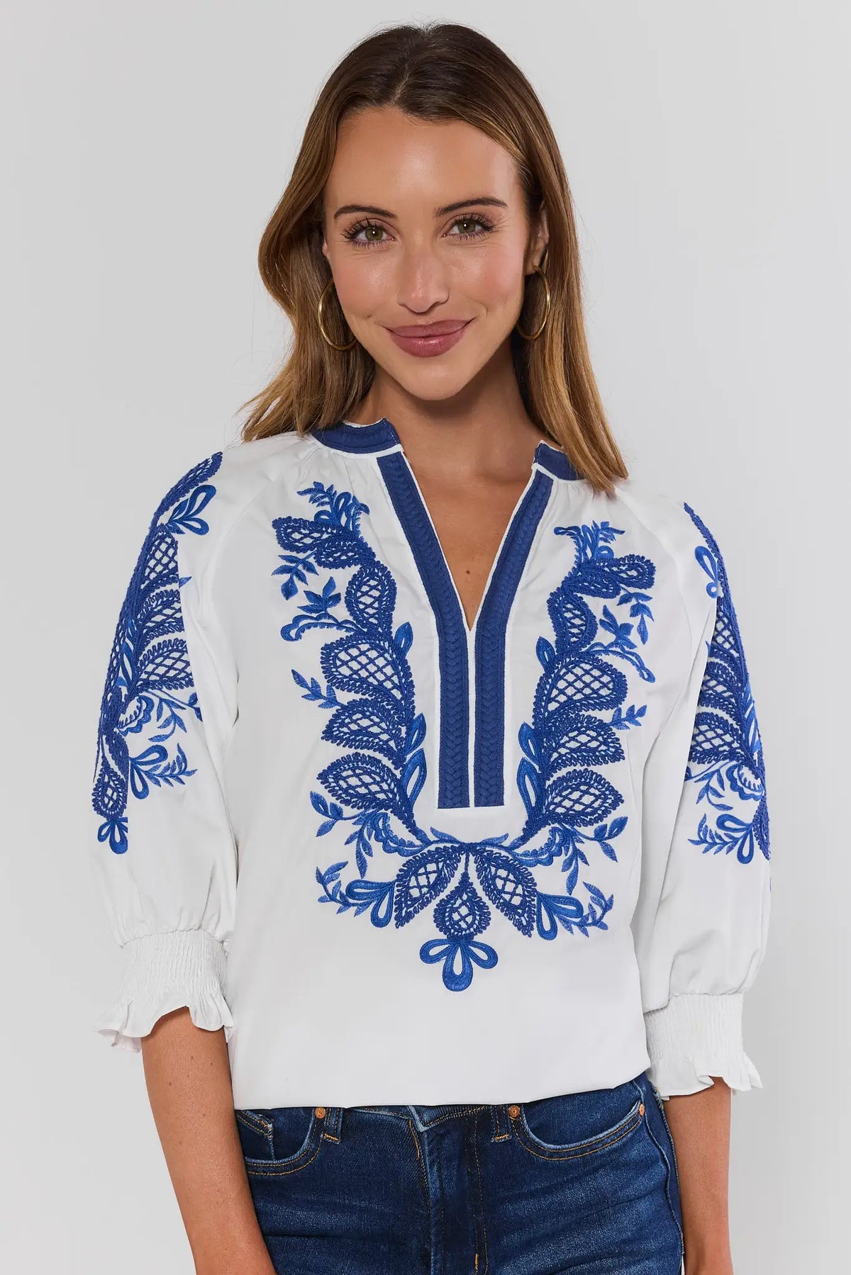 Iris White Embroidered Split Neck Top paired with denim jeans - On Model Front View | Avara