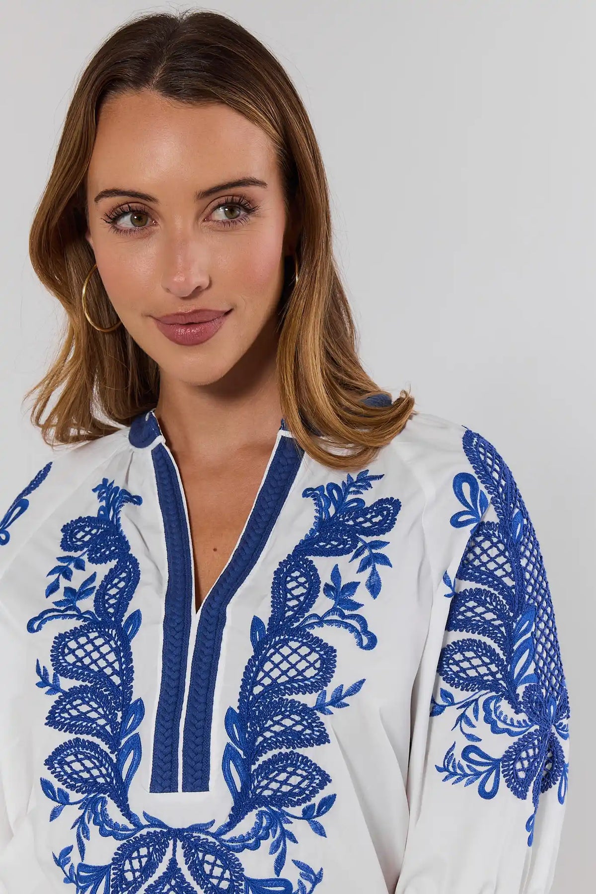 Iris White Embroidered Split Neck Top close-up showing blue embroidery detail at neckline | Avara