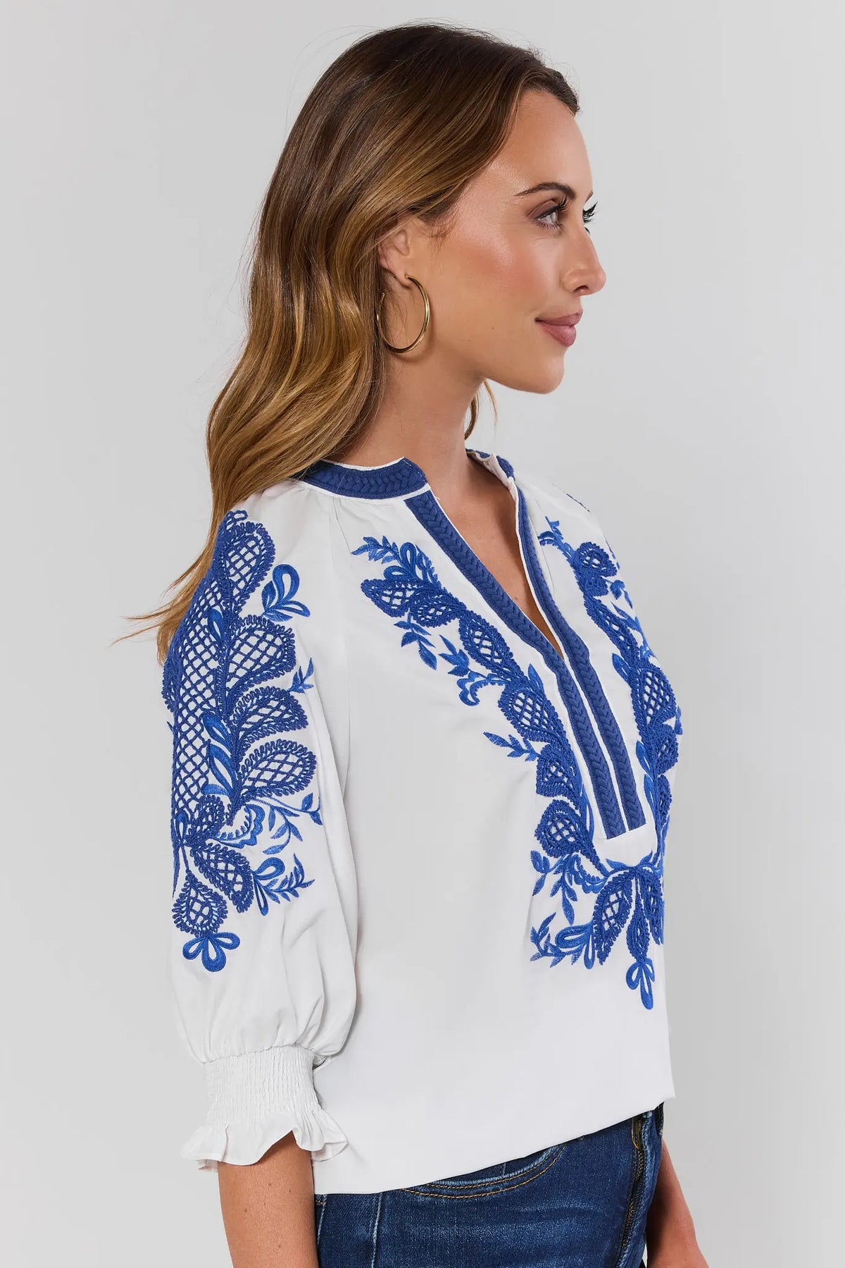 Iris White Embroidered Split Neck Top with blue sleeve embroidery detail - Side Profile View | Avara