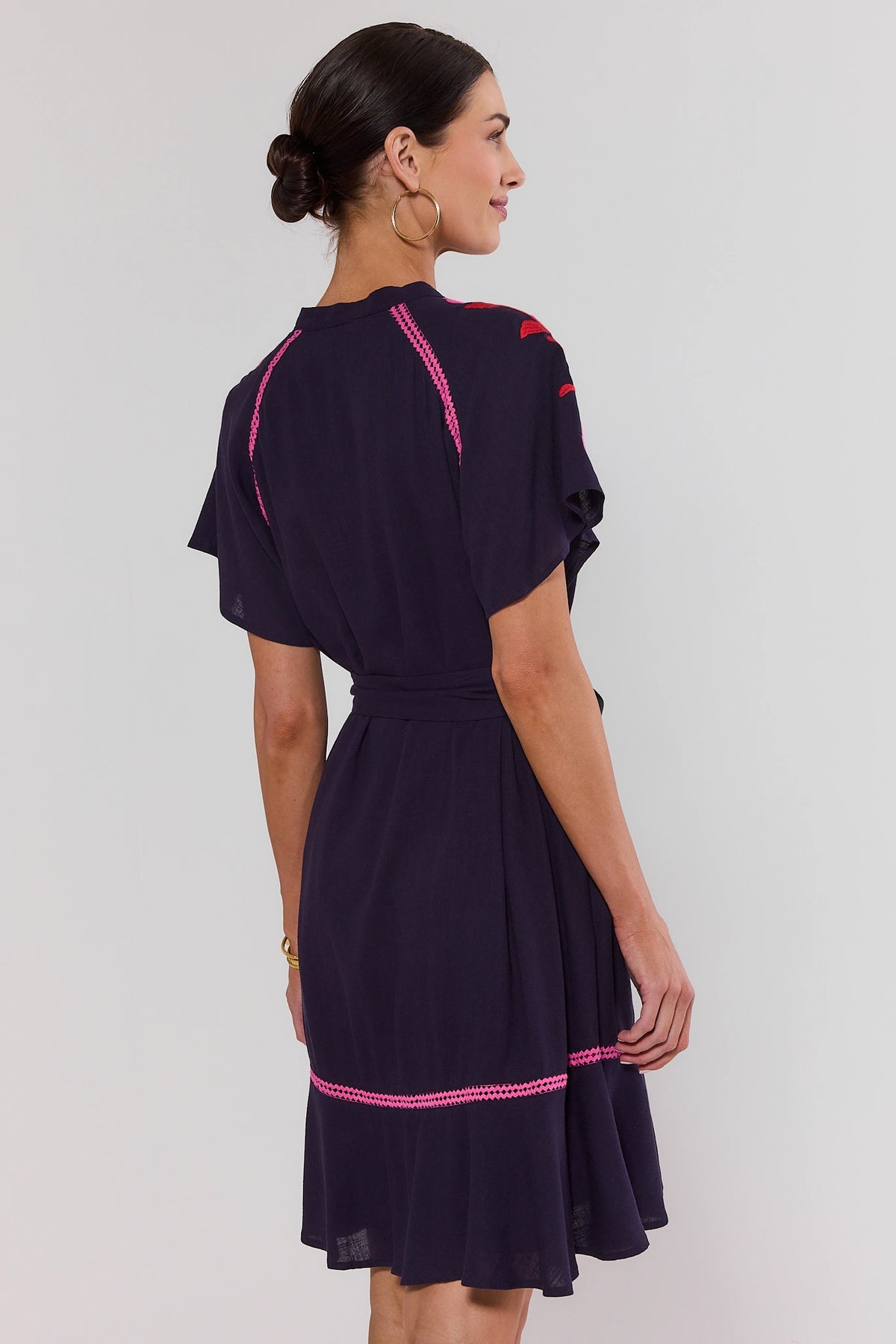 Ana Plum Embroidered Short Dress - Back View On Model, Flutter Sleeves and Ruffle Hem | Avara