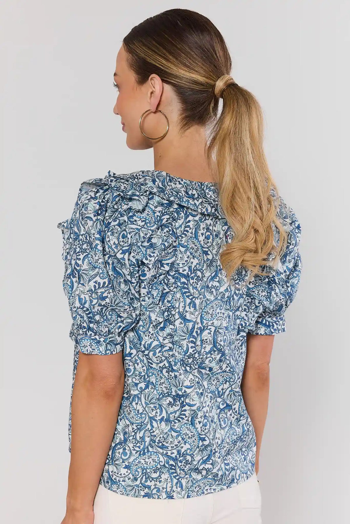 Blue paisley print ruffle top showing back view and shoulder ruffle detail - Back View | Avara