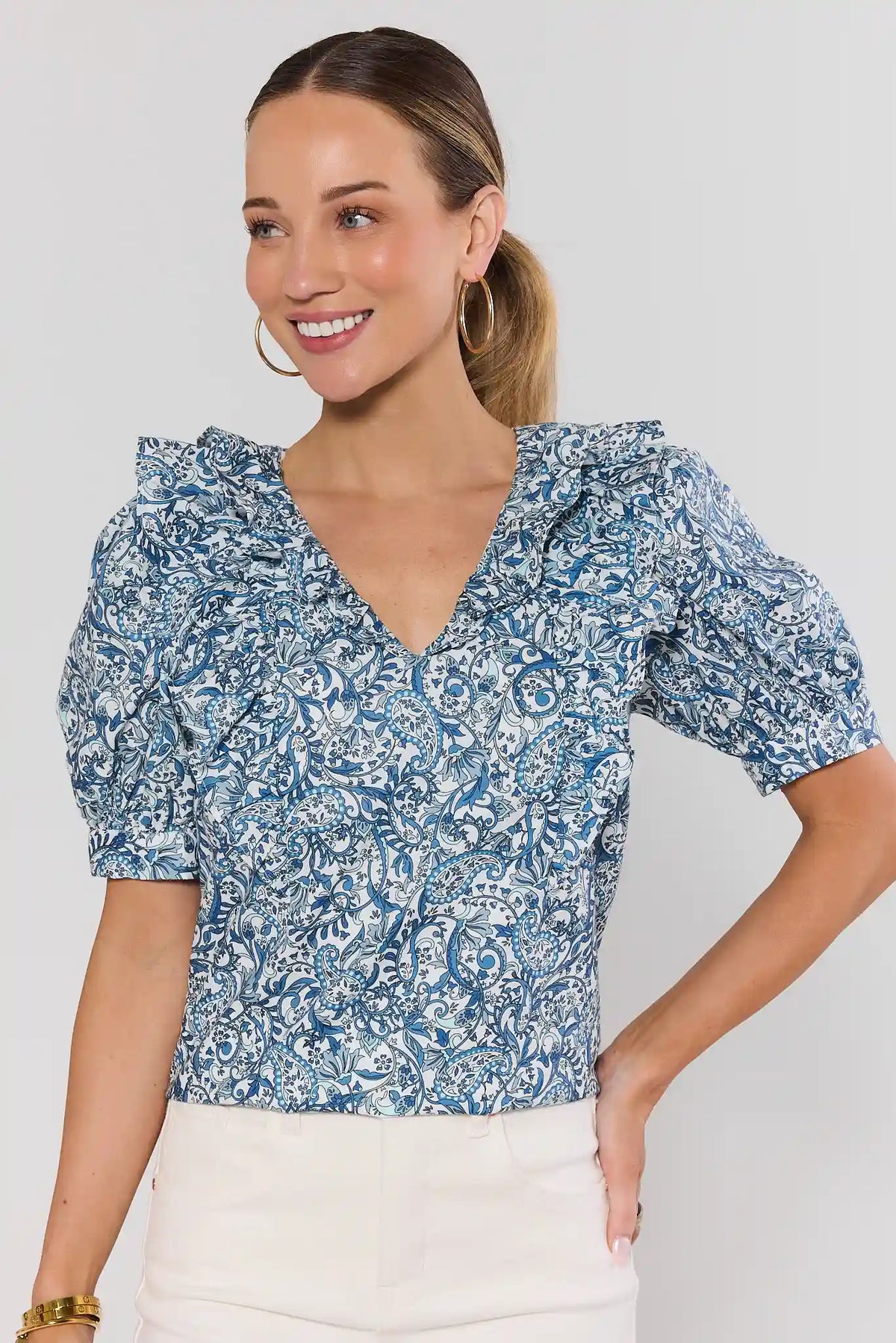 Blue paisley print ruffle top with V-neck and puff sleeves - Front View | Avara