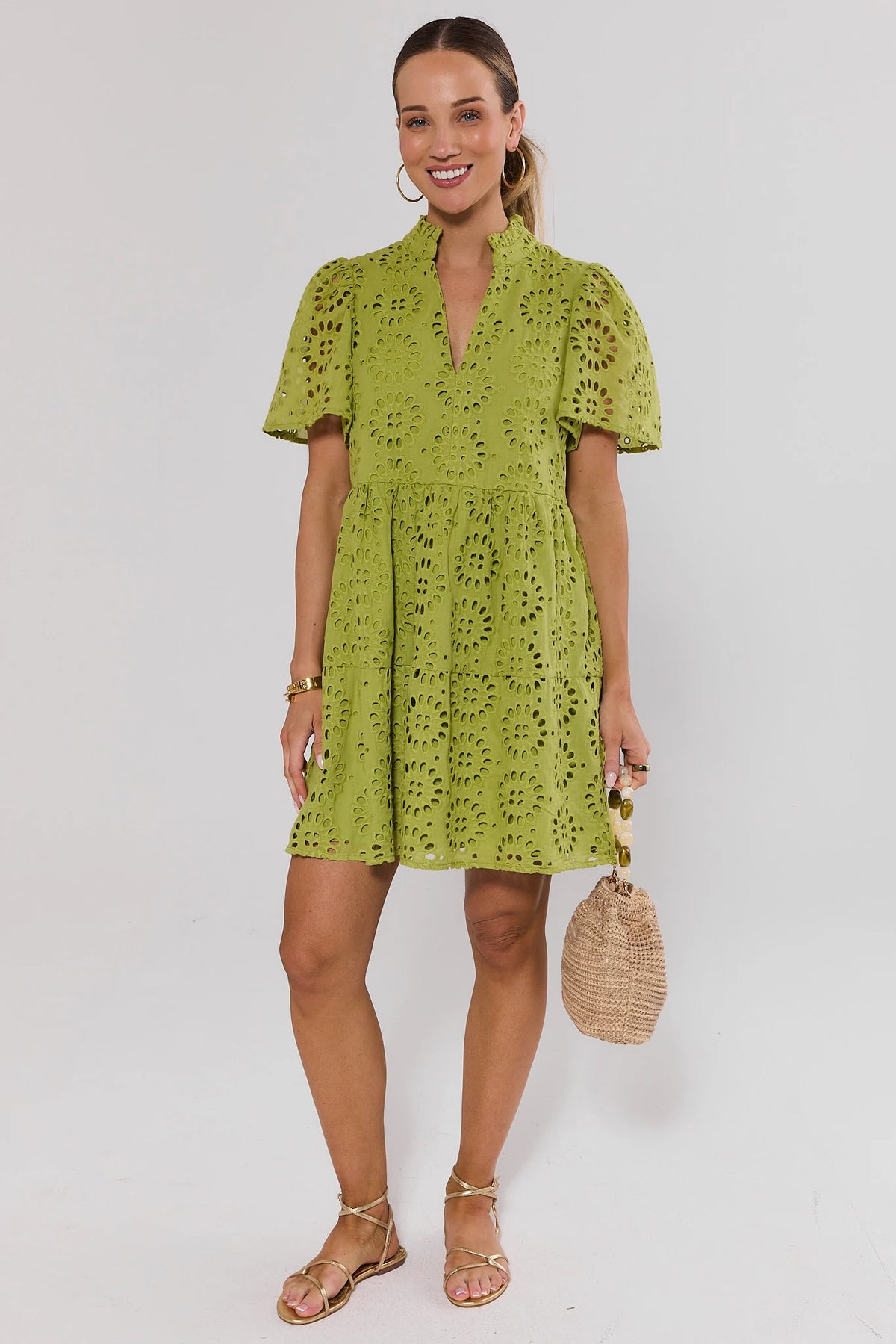 Womens Green Eyelet Short Dress Styled with Strappy Sandals and Woven Bag | Avara