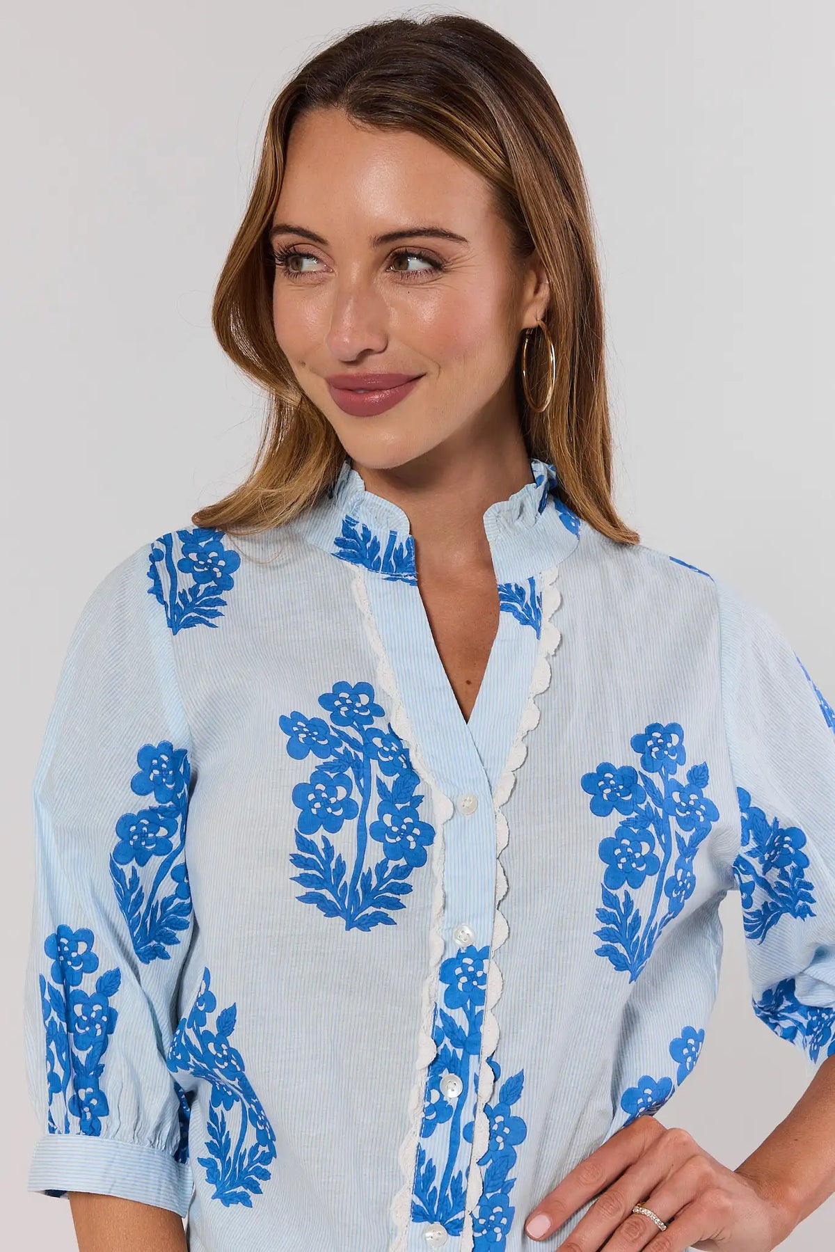 Blue printed button-up top by THML - Close-Up Detail, ruffled neckline & scallop trim | Avara
