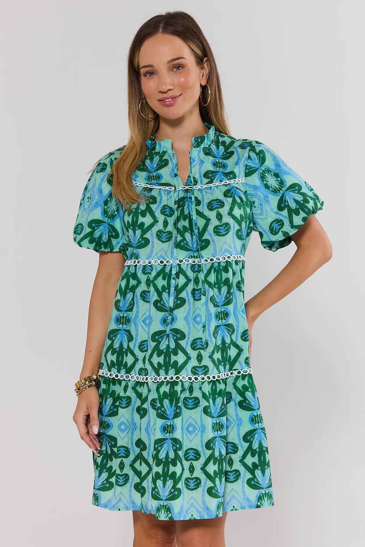 Reina Green Printed Short Dress full-length front view, tiered A-line silhouette with puff sleeves | Avara