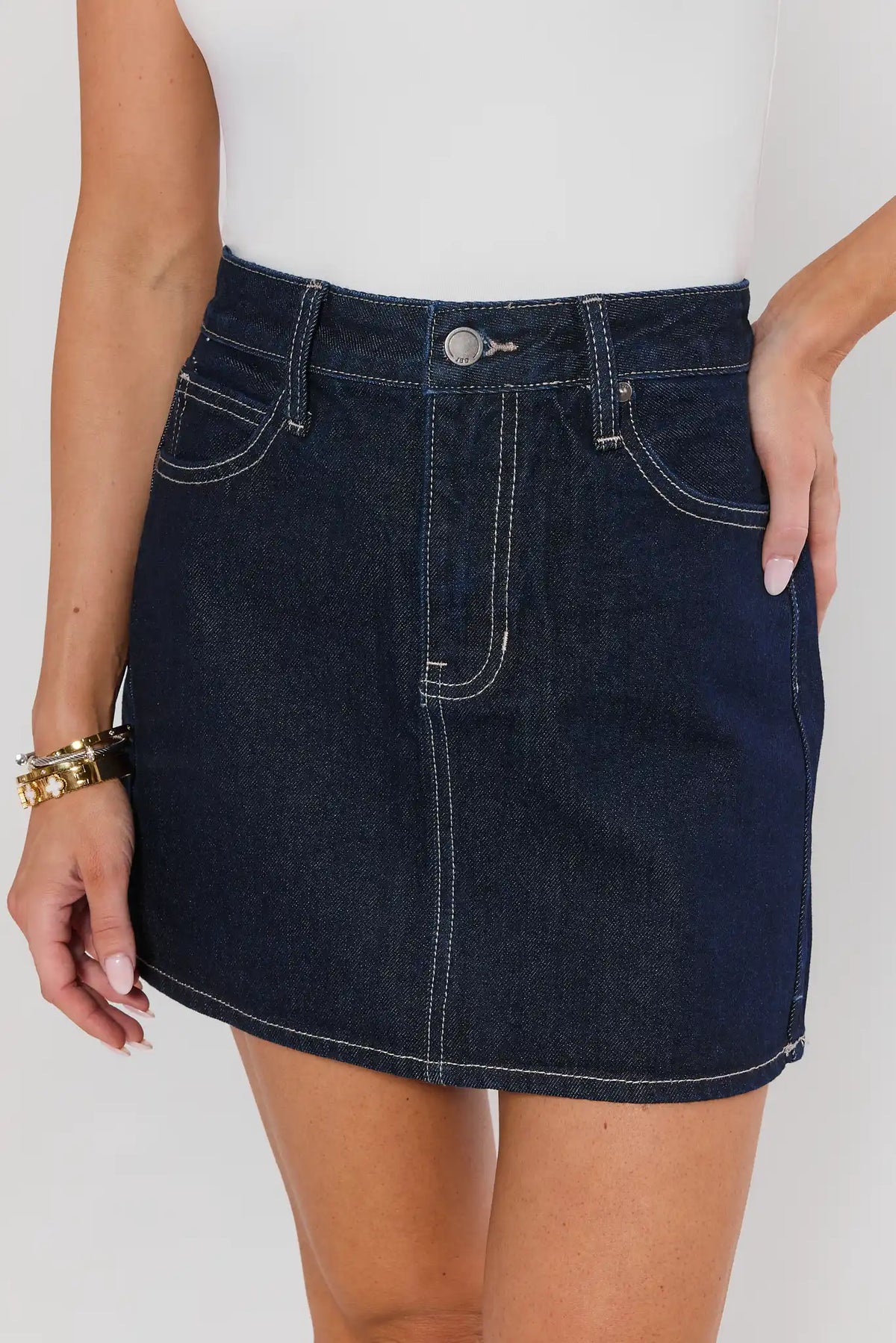 Mallory Dark Wash Denim Skirt close-up, high-rise waist and contrast stitching detail | Avara