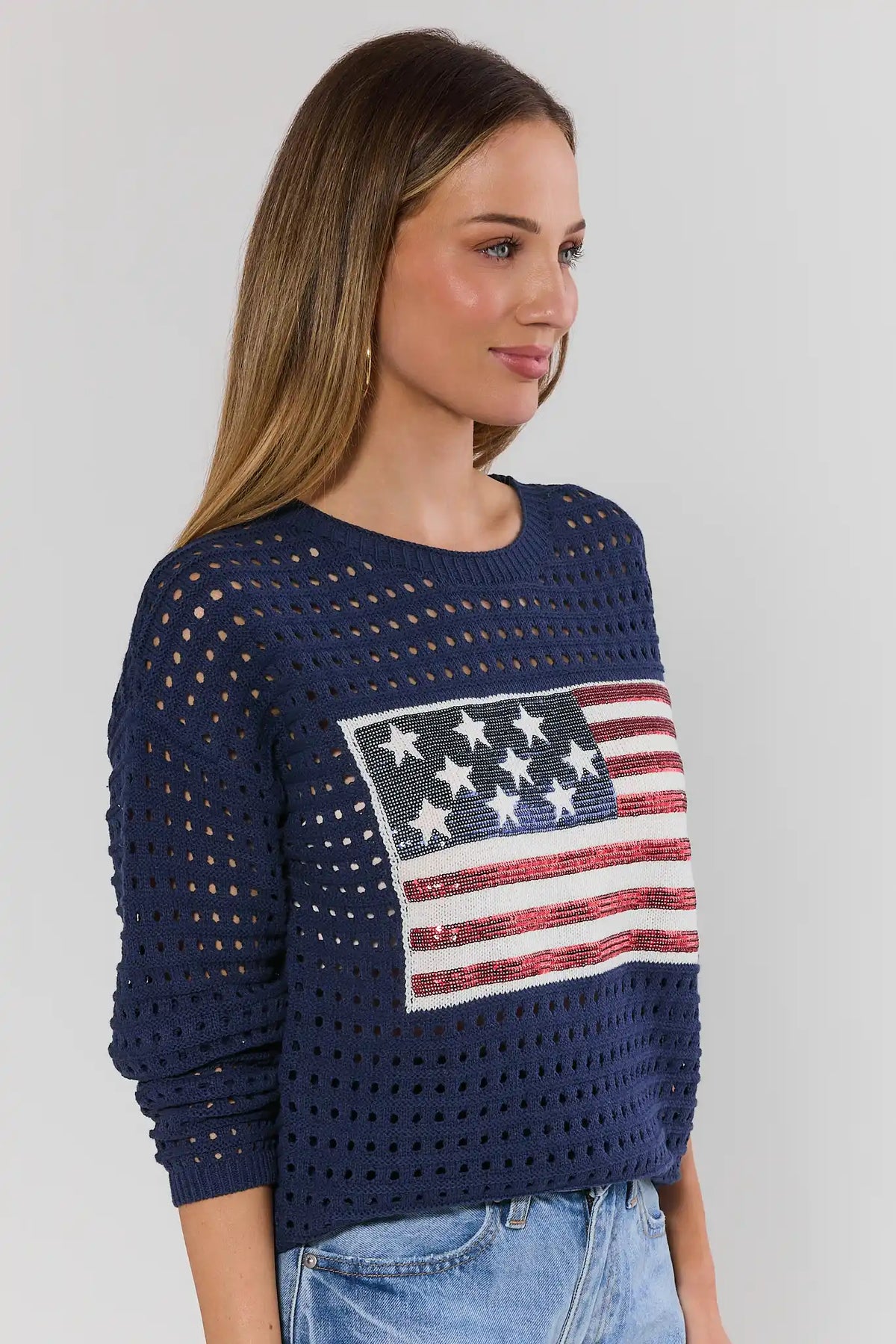 Starla Navy Sequin Flag Crochet Sweater showing open-knit texture - Side Profile | Avara