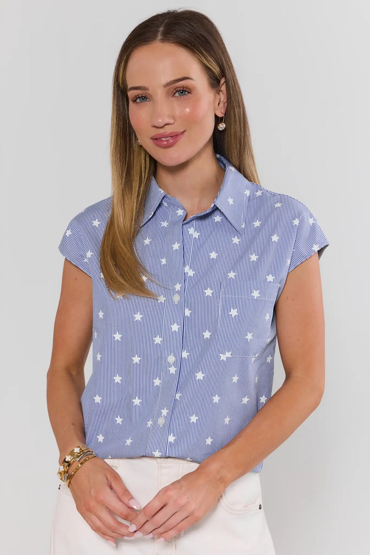 Woman wearing blue striped star button-up top with cap sleeves and collar - Front View | Avara