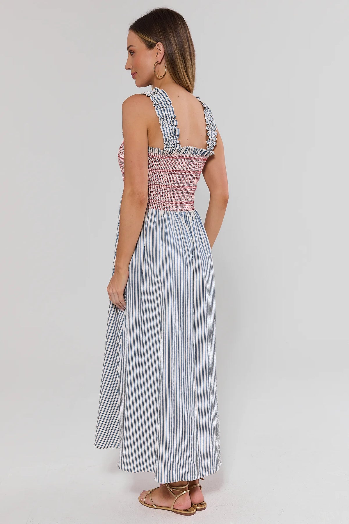 Teagan Smocked Midi Dress by THML in blue stripe seersucker - Back View showing open back and ruffle straps | Avara