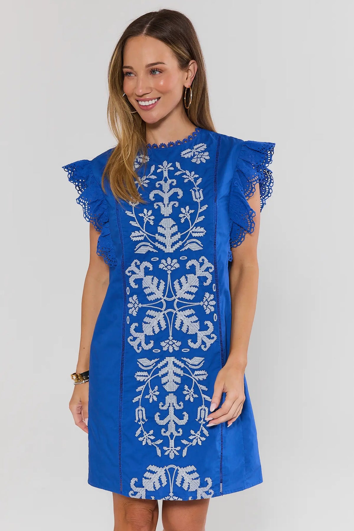 Royal blue flutter sleeve short dress with white needlepoint embroidery and eyelet trim - Front View | Avara