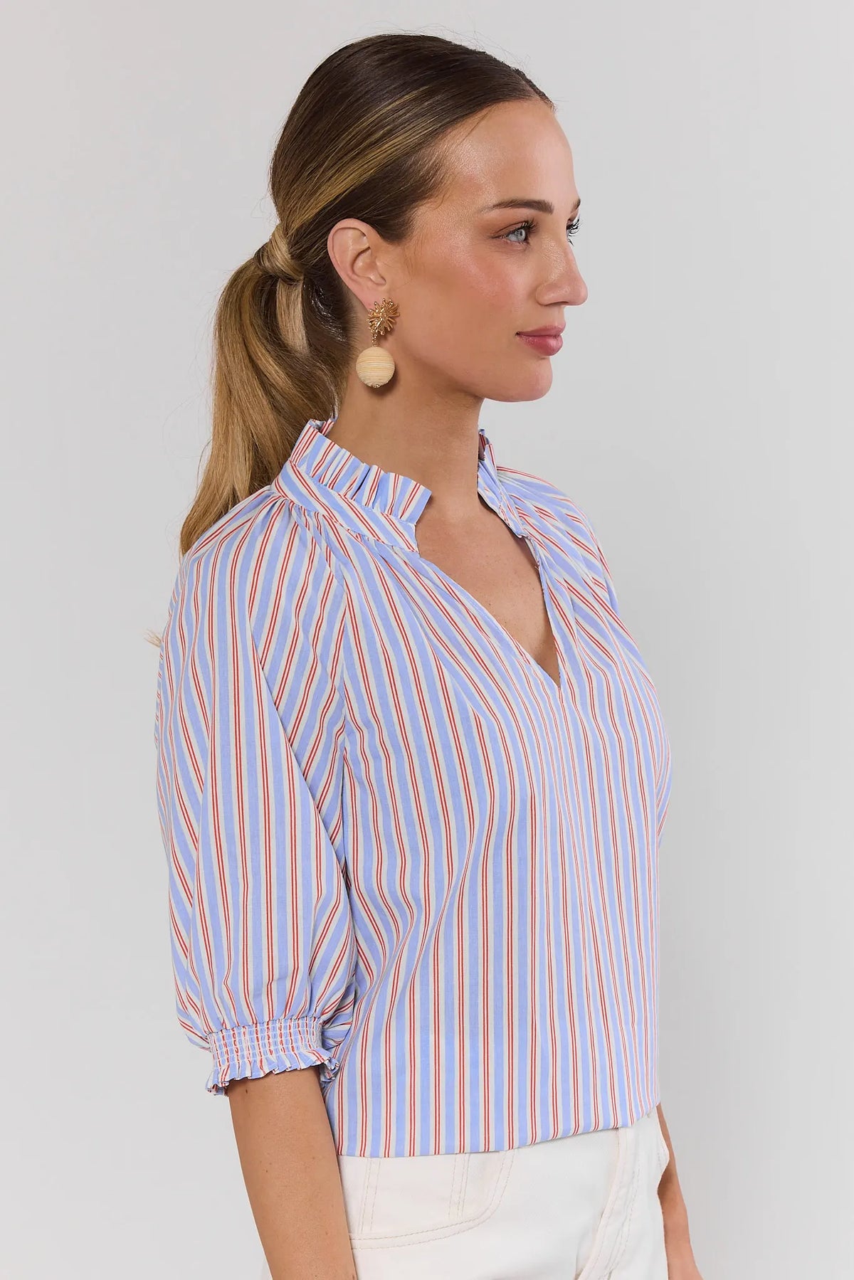 Merrick Blue Striped Split Neck Top showing smocked sleeve cuff - Side Profile View | Avara