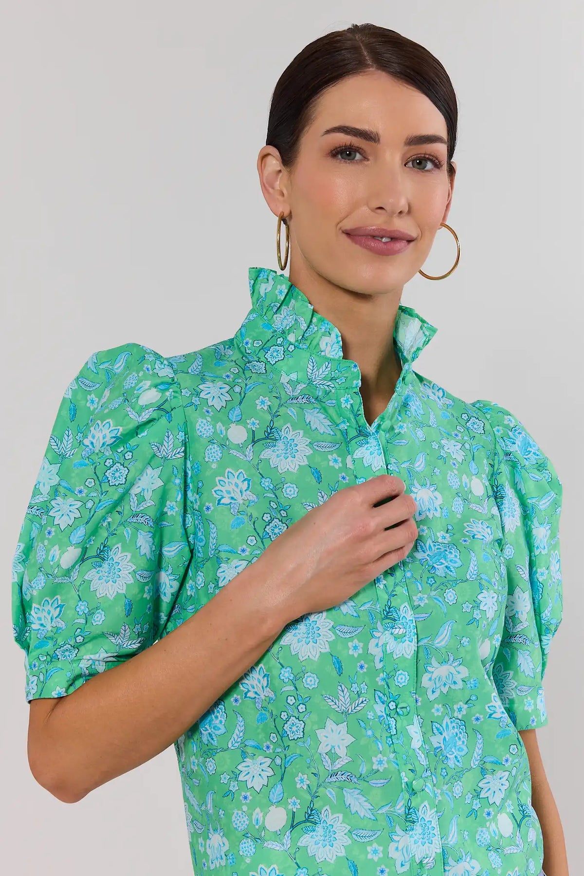 Close-up of green floral button-up top with ruffle collar and puff sleeves - Detail View | Avara