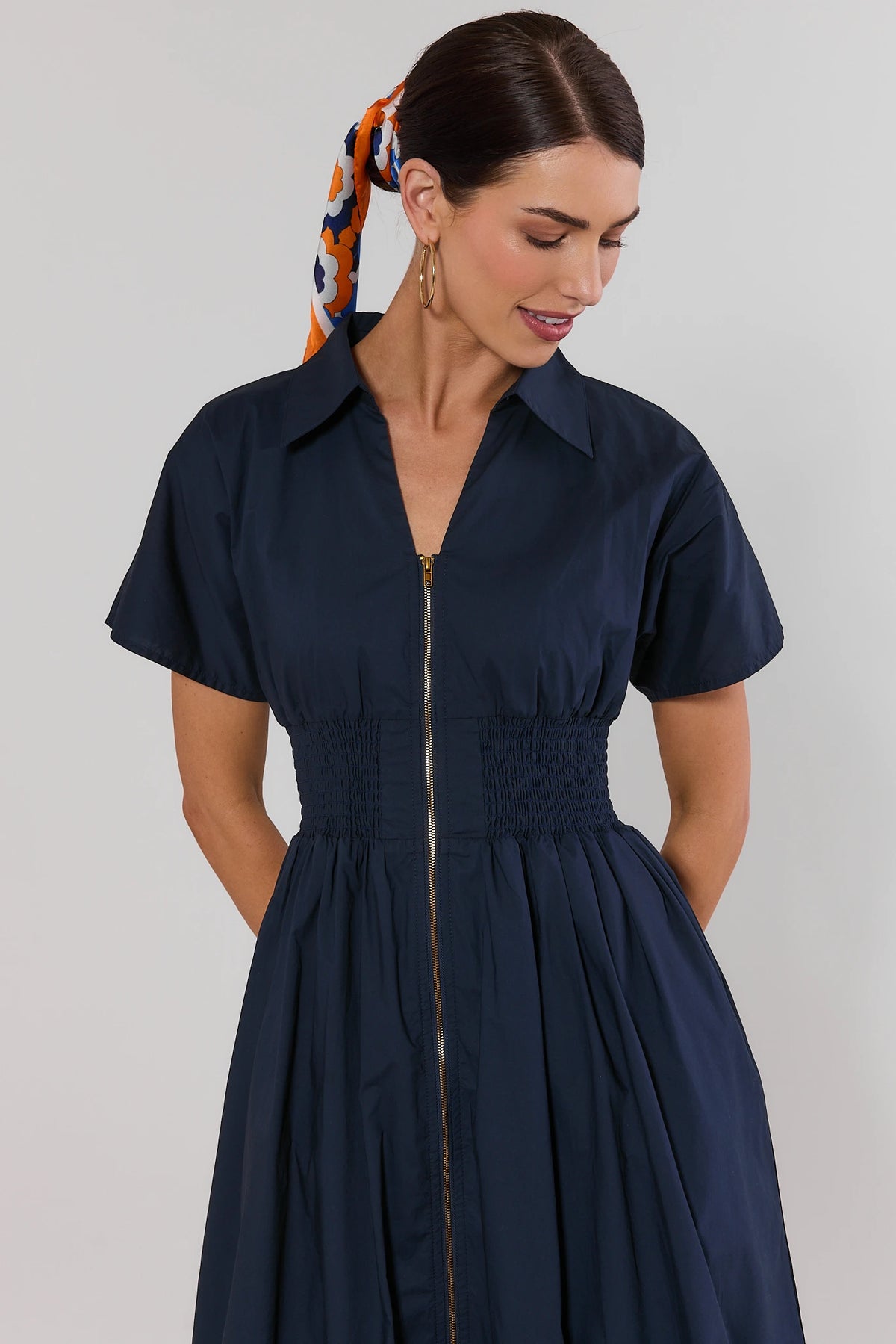Navy Zip Up Midi Dress smocked waist detail with gold front zipper - Close-Up | Avara