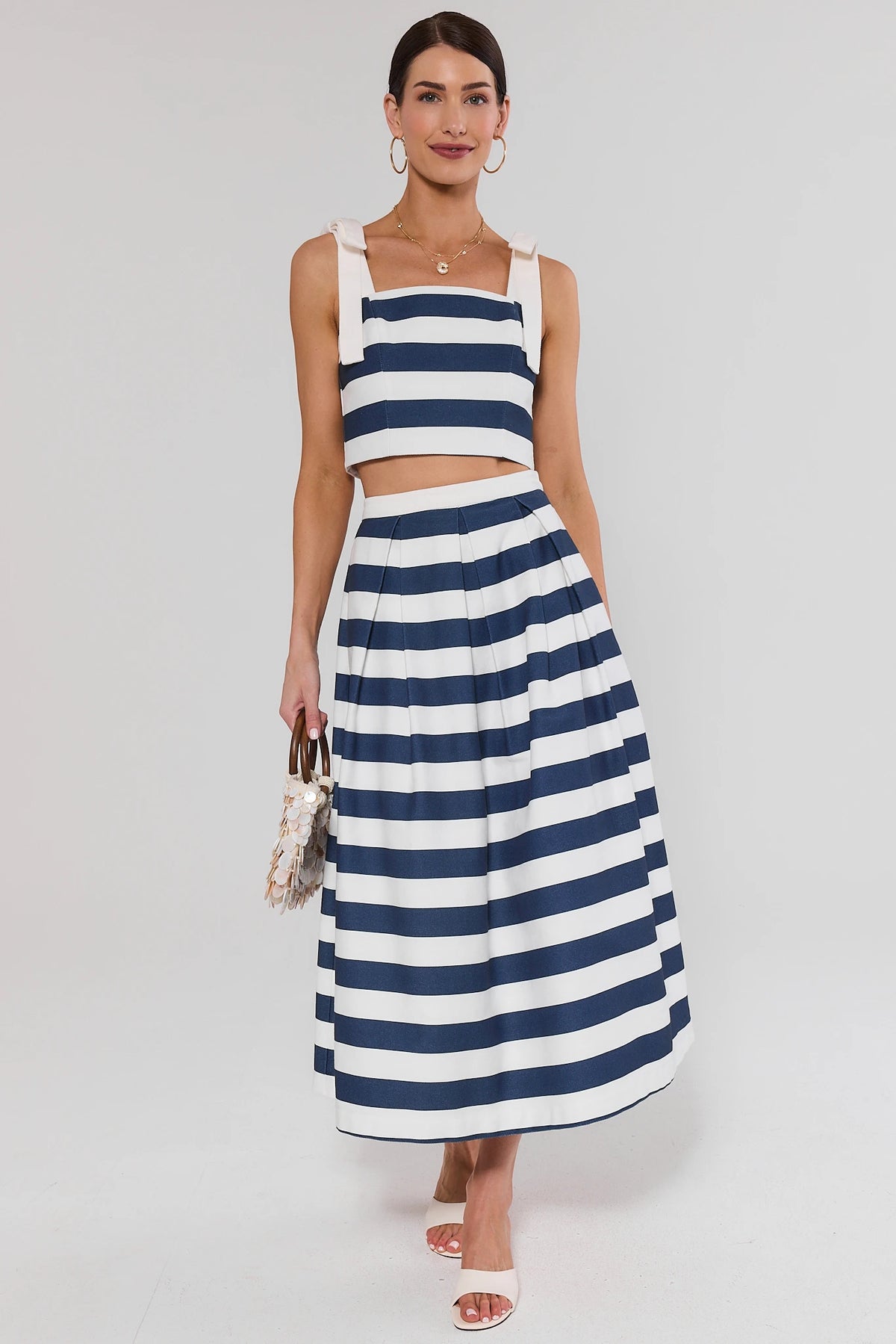 Navy striped cropped tank top styled with matching midi skirt, full-length front view on model | Avara