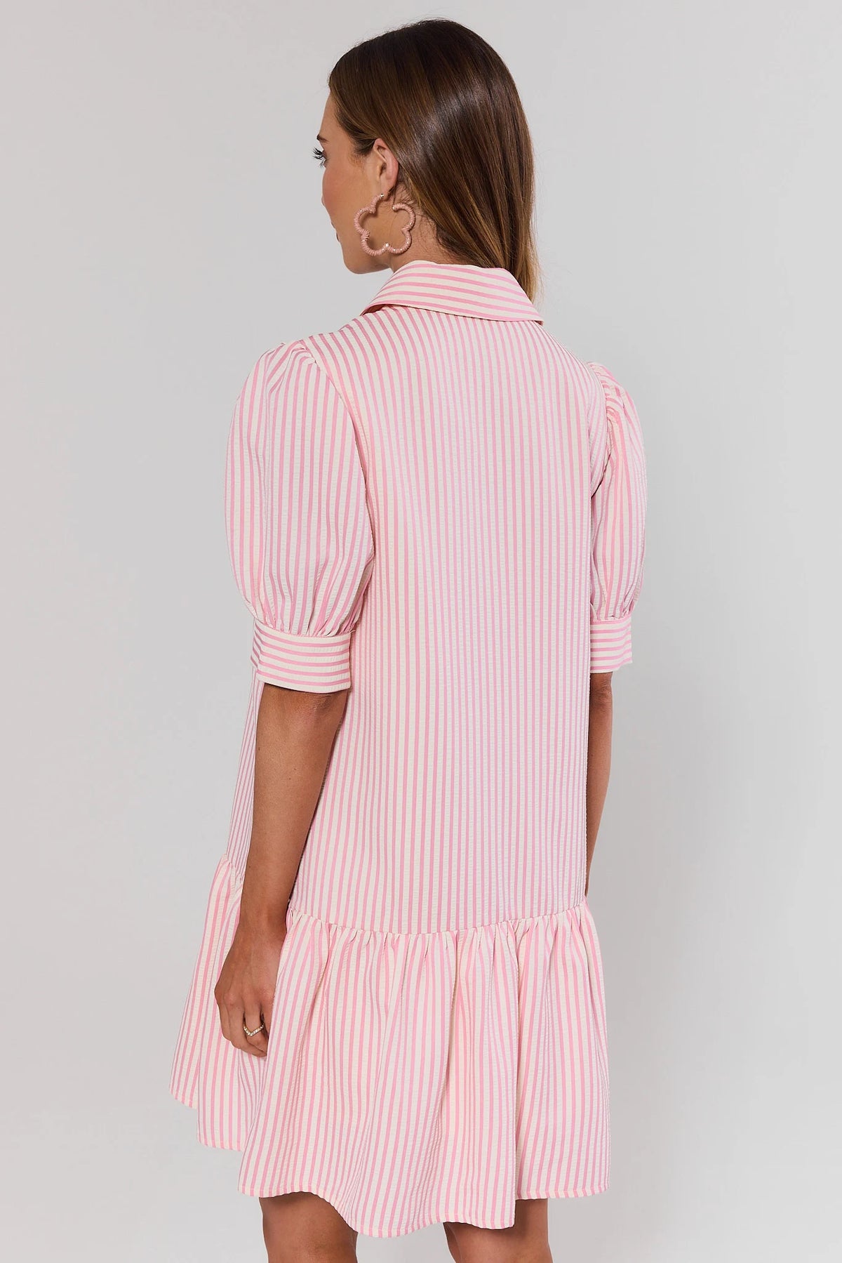 Beth Pink Striped Seersucker Short Dress - Back View Showing Puff Sleeves and Ruffle Hem | Avara