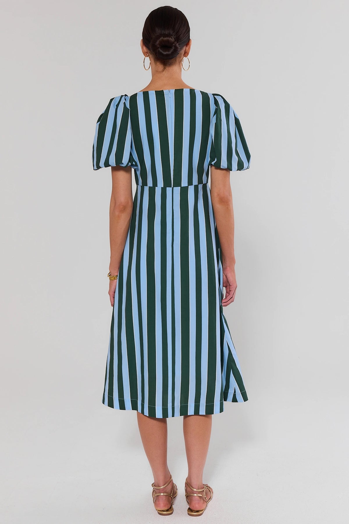 Blue striped puff sleeve midi dress back view showing zip closure and A-line skirt | Avara