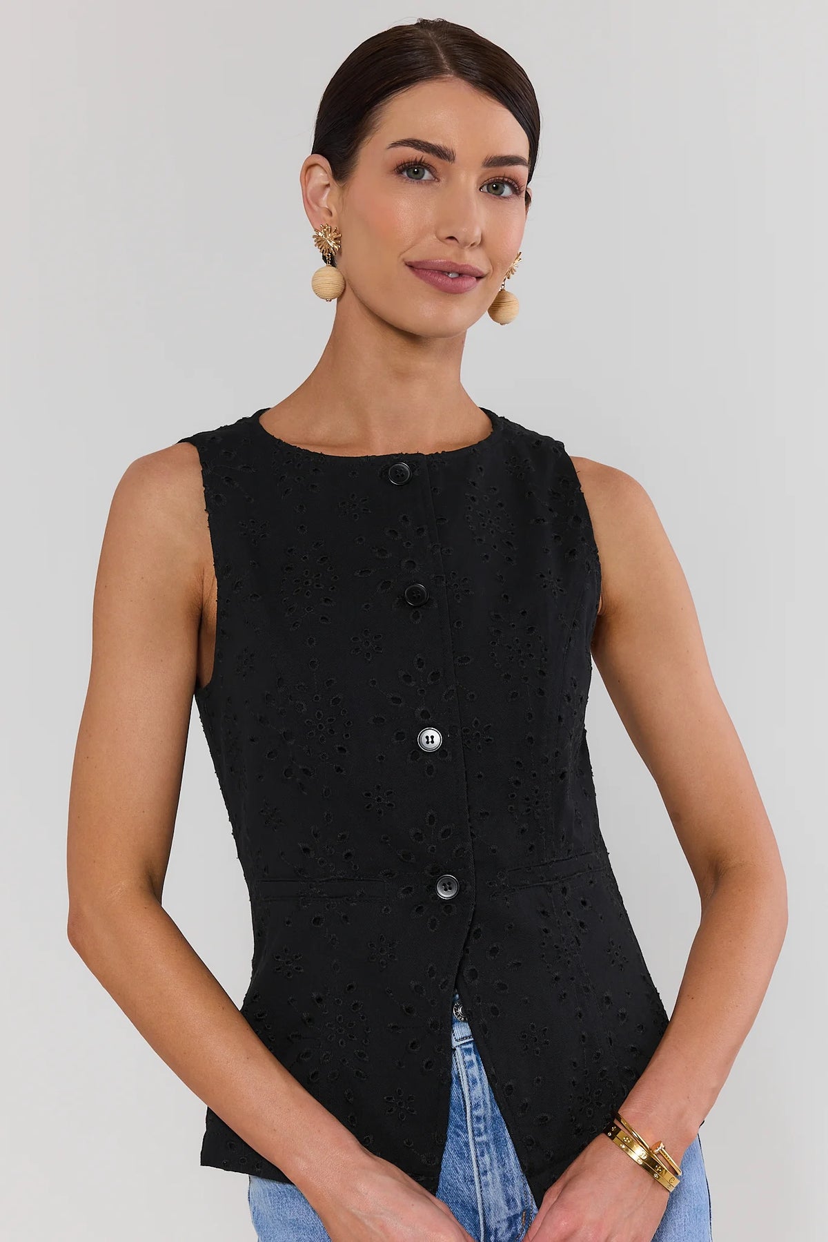 Black Eyelet Button Up Vest with button front and tailored silhouette - Front View On Model | Avara