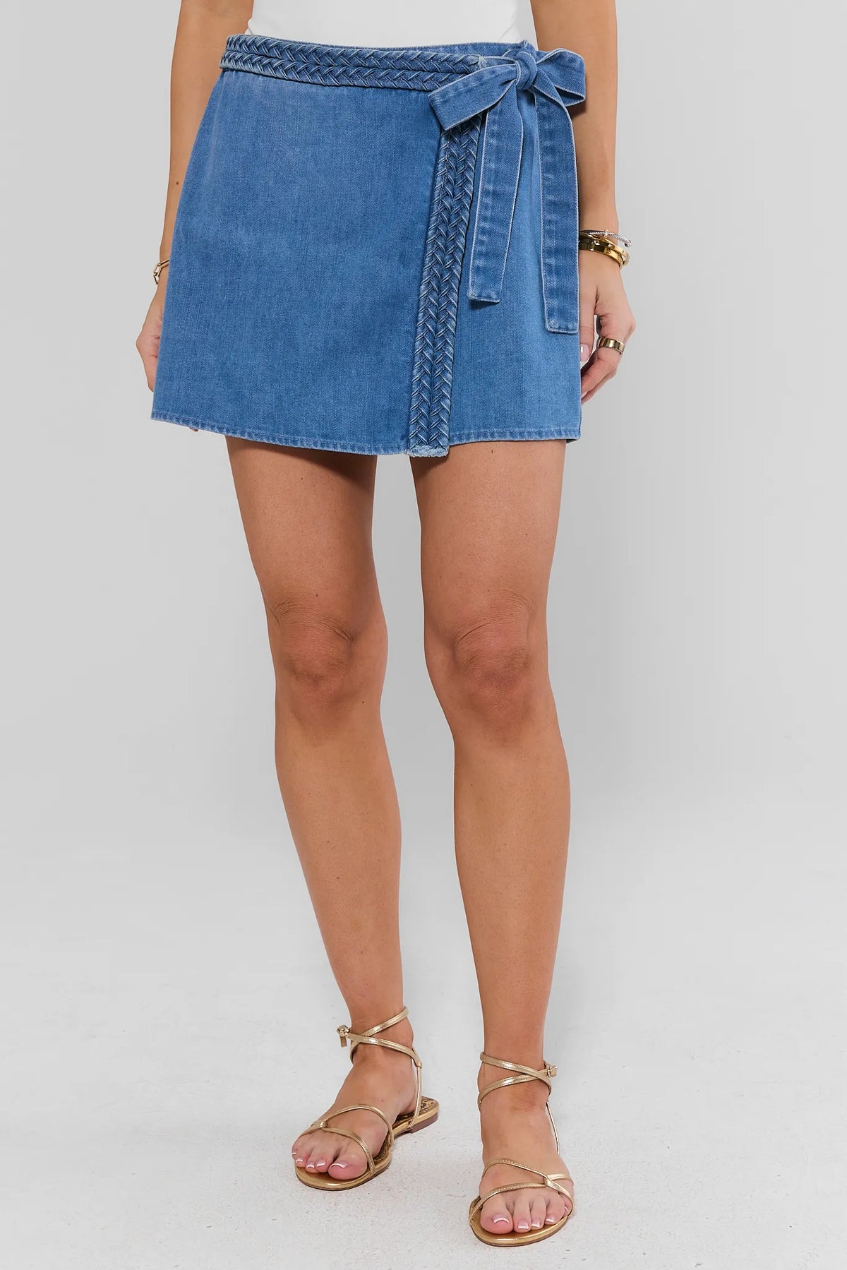 Farrah Denim Wrap Skort with braided belt - Front View On Model with gold sandals | Avara