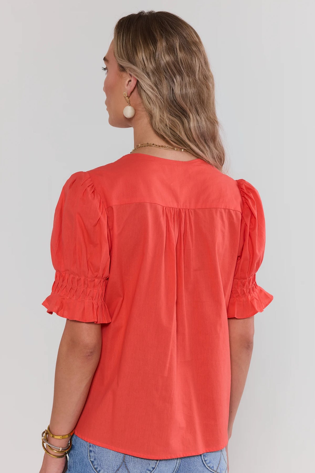 Orange Pleated Short Sleeve Top with smocked ruffle cuffs - Back View | Avara