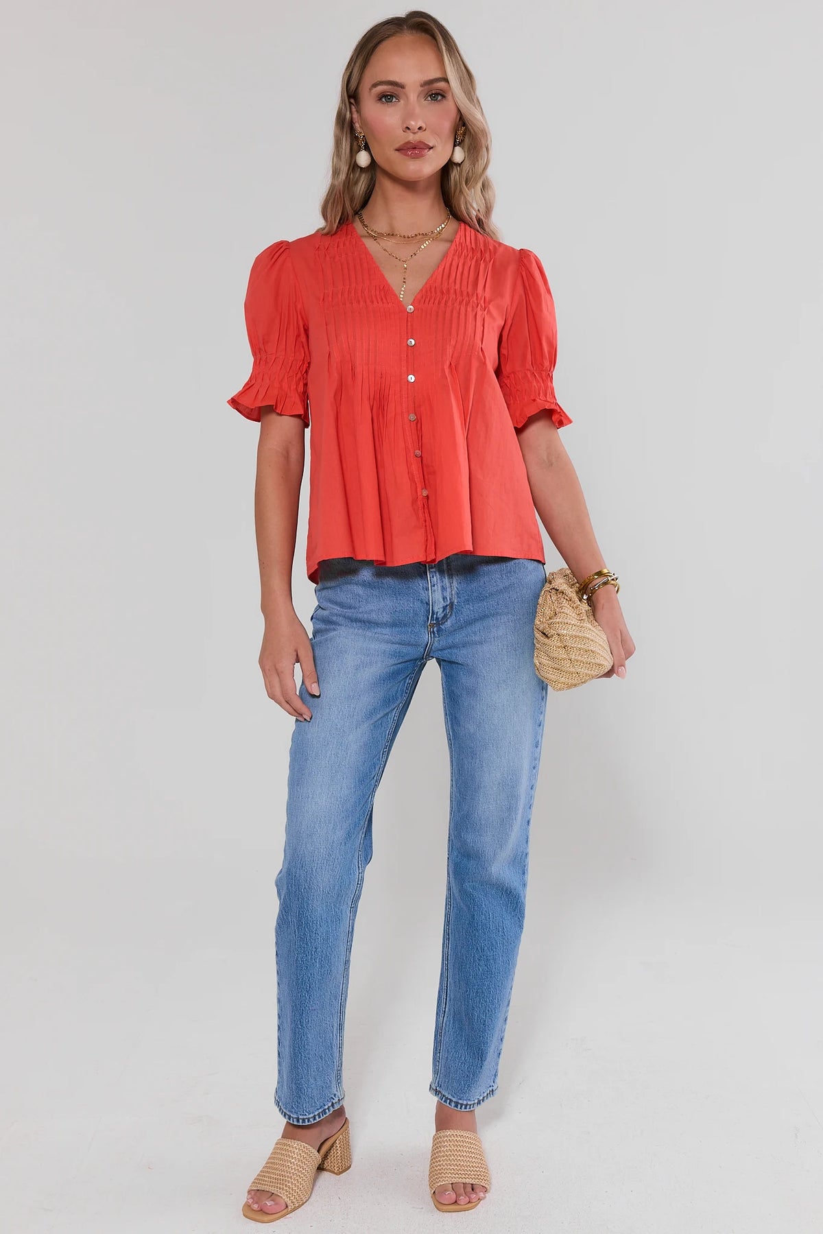 Orange short sleeve top styled with blue jeans & woven bag - Full Length View | Avara