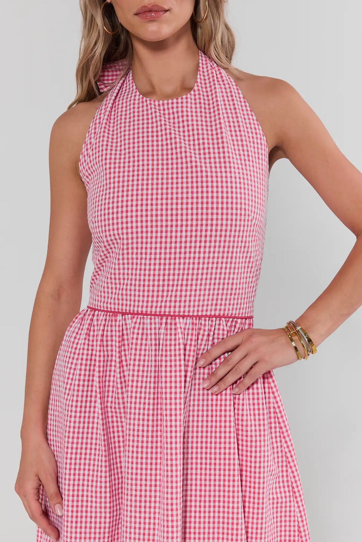 Red gingham maxi dress halter bodice with contrast piping and drop waist detail - close-up front | Avara