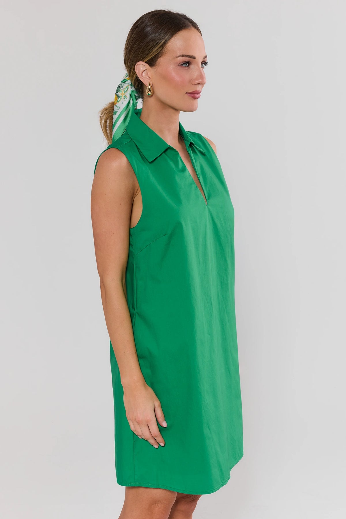 Green Ellen Short Dress side profile on model with floral hair scarf, shift silhouette | Avara